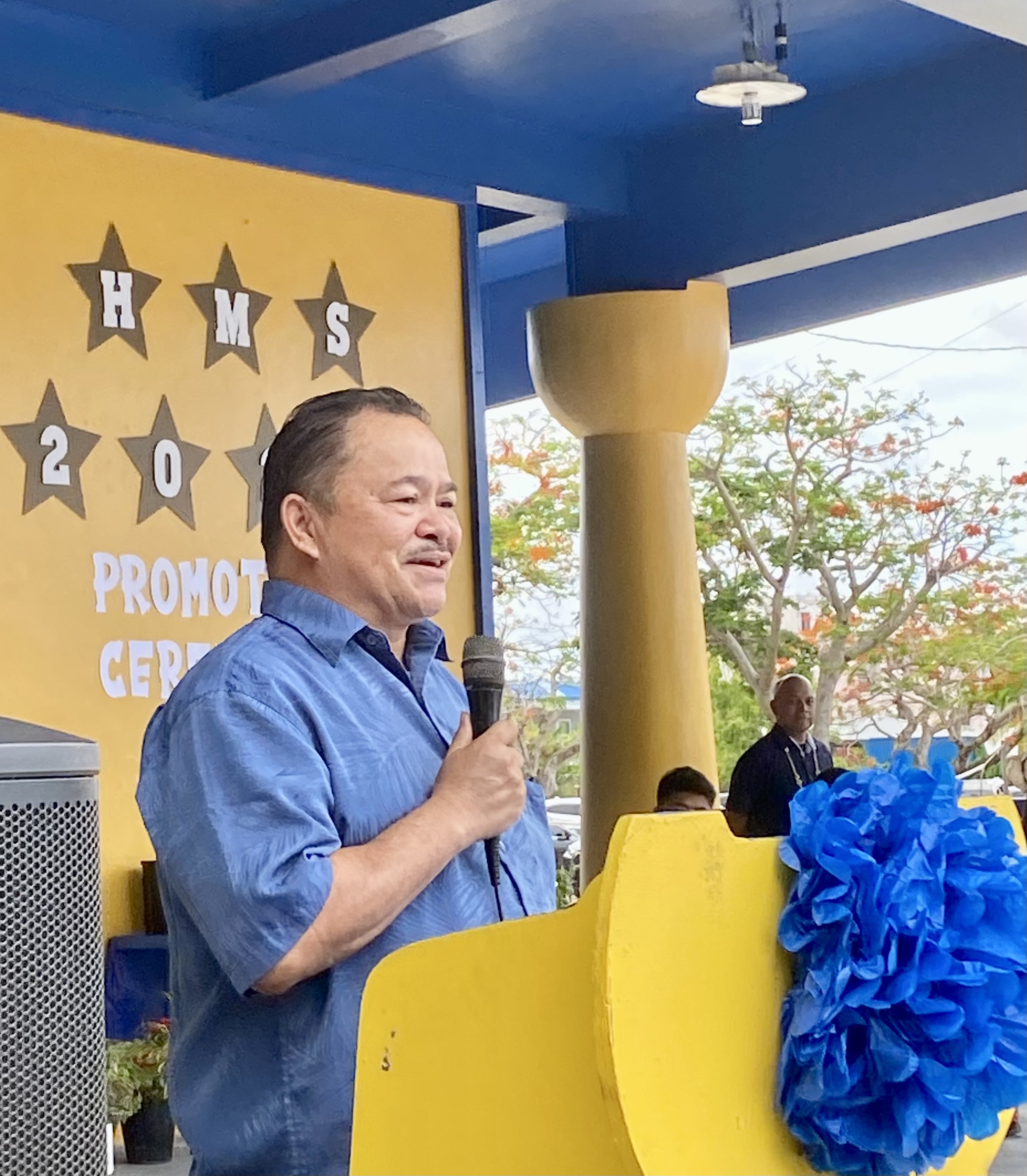 Commissioner of Education Dr. Alfred B. Ada commends promoted class of Hopwood Middle School.