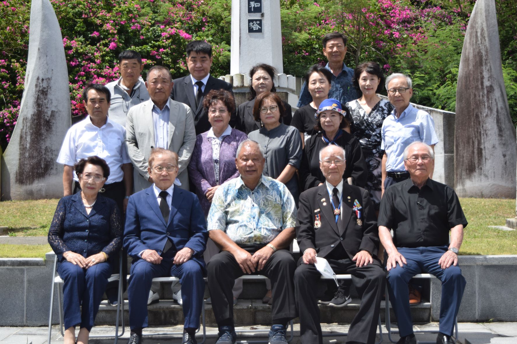 Saipan Mayor David M. Apatang, center, joins South Korea Public Administration honorary director and Memorial Service Association for the Deceased Compatriots Overseas chairman, Yong Taek Lee, second right, seated, and South Korea’s first minister of the Ministry of Communications, Dae Soon Lee, second left, seated, during a memorial service at the Korean Peace Memorial in Marpi on Friday. With them are Korean Cultural Center Chairman Kim Hong Gyun, second left, second row, and other members of the Korean community of Saipan.