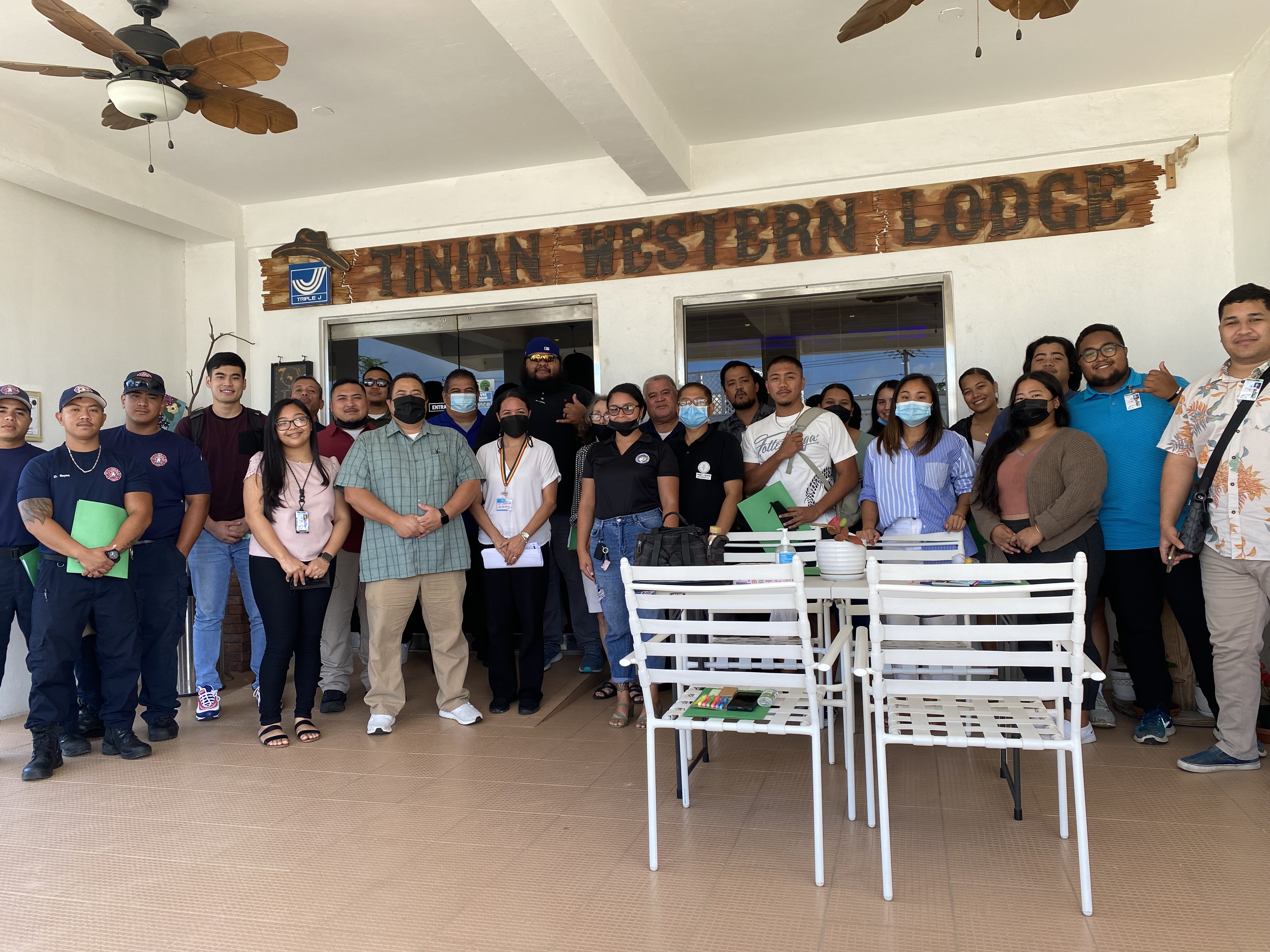 Stakeholders from Tinian, along with CHCC and Community Guidance Center staff, take time for a group photo with training facilitator Dr. Jen Maratita after completing training on Screening, Brief Intervention and Referral to Treatment.