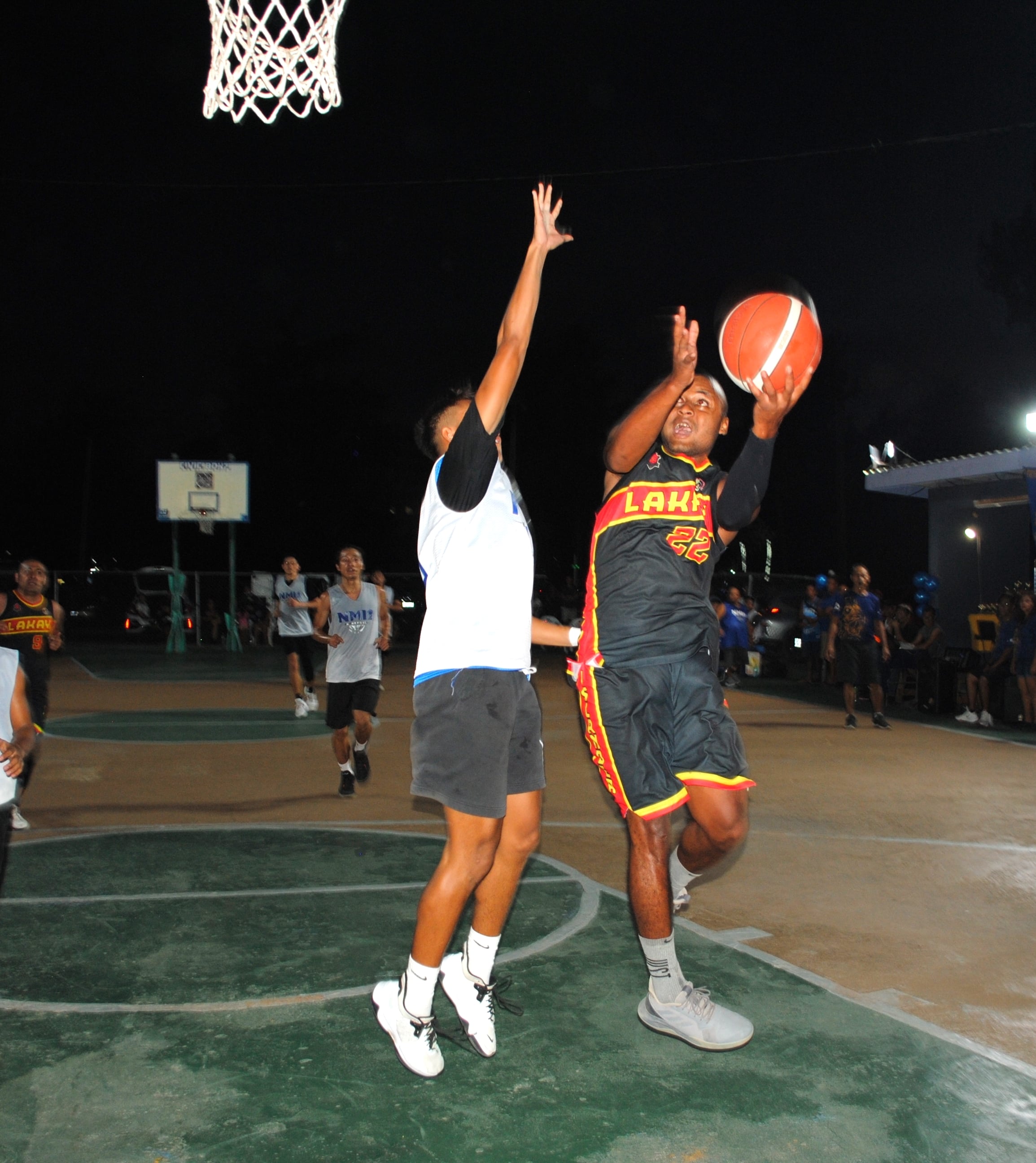 Lakay/Islander's Gant protects the ball as he goes up for the layup.