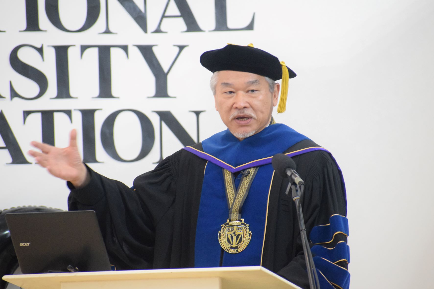 Dr. Christian Wei, EUCON International University president/administrator, delivers his remarks during the commencement exercises at EUCON's Adonai Auditorium in Gualo Rai on Saturday.
