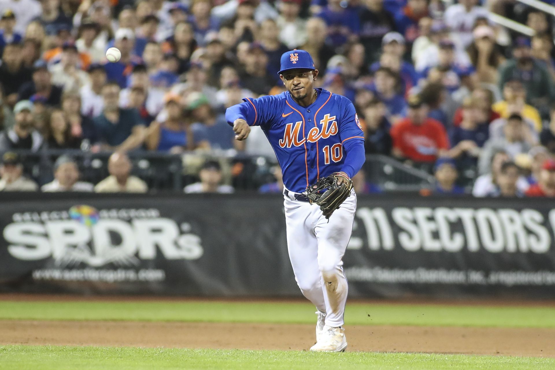 New York Mets third baseman Eduardo Escobar (10) makes a running throw for an assist in the fourth inning against the Philadelphia Phillies at Citi Field in New York City on May 29, 2022.