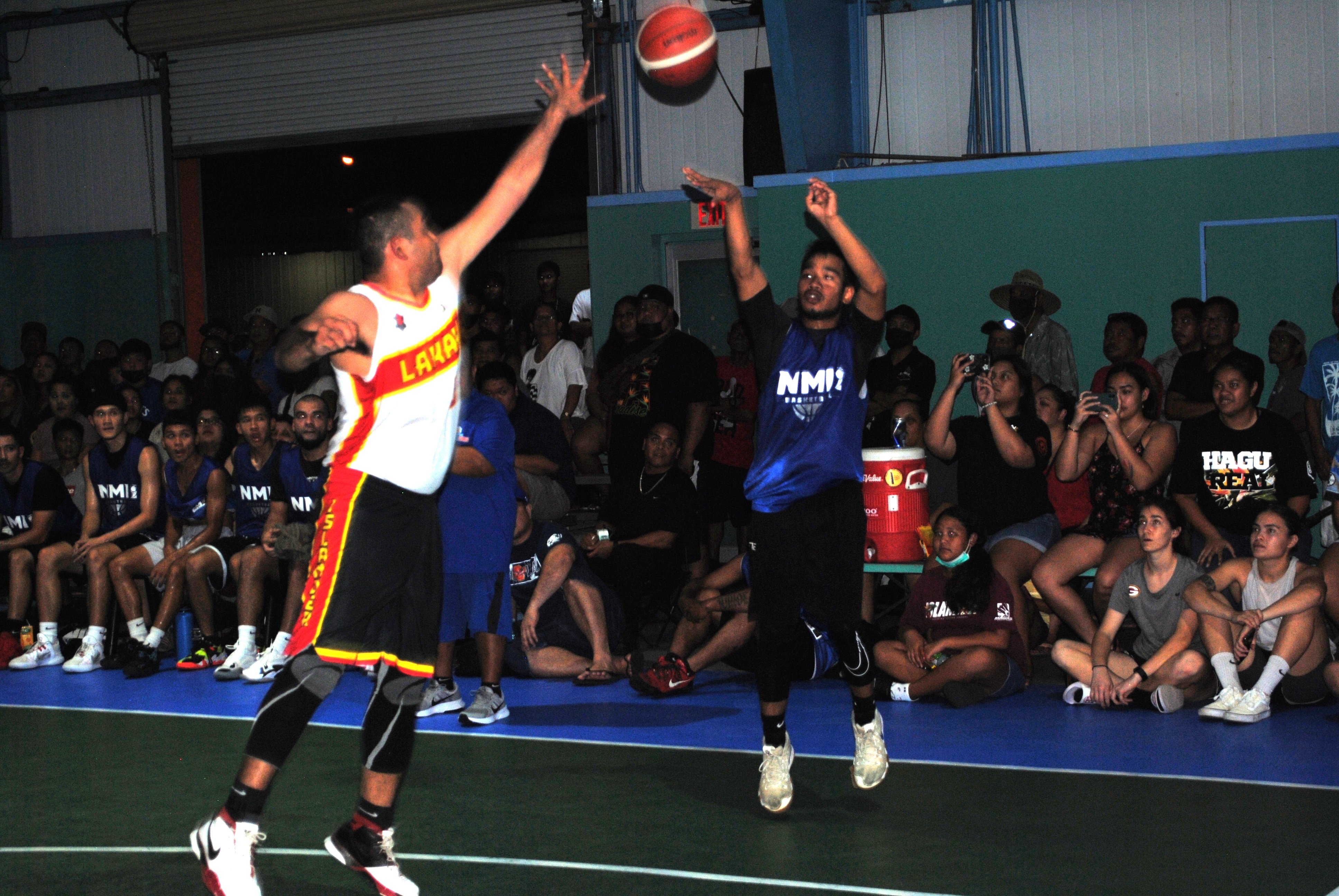 Marianas' Castro pulls up for the three-point shot over Lakay's Rabauliman during the open division championship game of the Saipan Centennial Lions Club Basketball League Friday at the TSL Sports Complex.