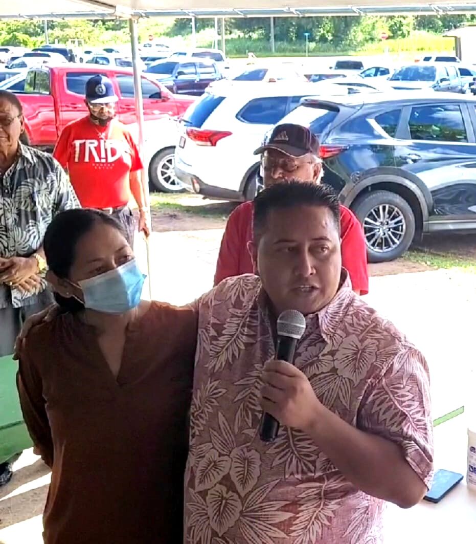 While first lady Diann T. Torres listens, Gov. Ralph DLG Torres speaks to his supporters at the canopy outside the legislative building Wednesday after the Senate voted to acquit him of the charges filed by the House leadership in six articles of impeachment.