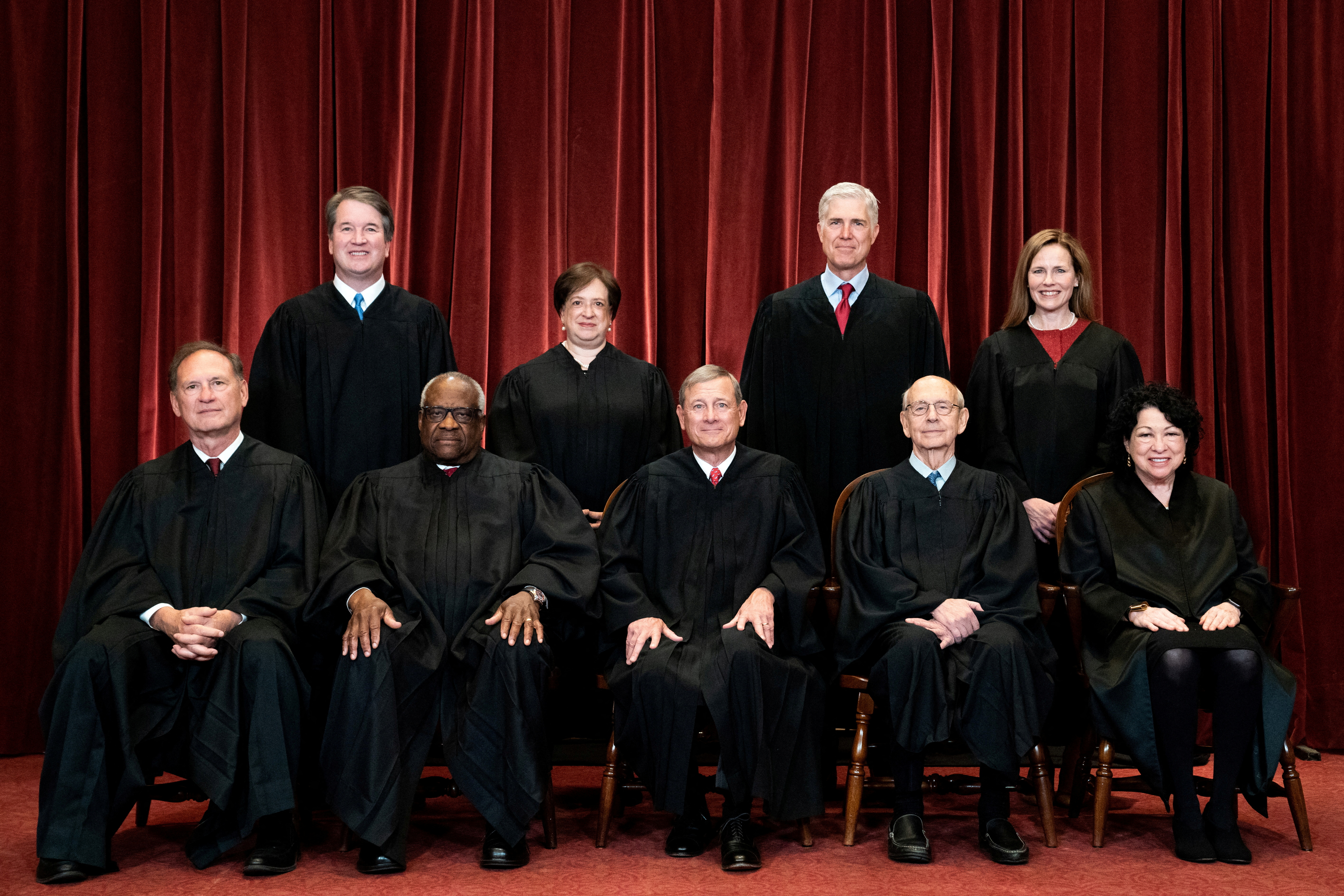 Associate Justice Brett Kavanaugh, Associate Justice Elena Kagan, Associate Justice Neil Gorsuch, Associate Justice Amy Coney Barrett, Associate Justice Samuel Alito, Associate Justice Clarence Thomas, Chief Justice John Roberts, Associate Justice Stephen Breyer and Associate Justice Sonia Sotomayor pose for a group photo at the Supreme Court in Washington, D.C., April 23, 2021.