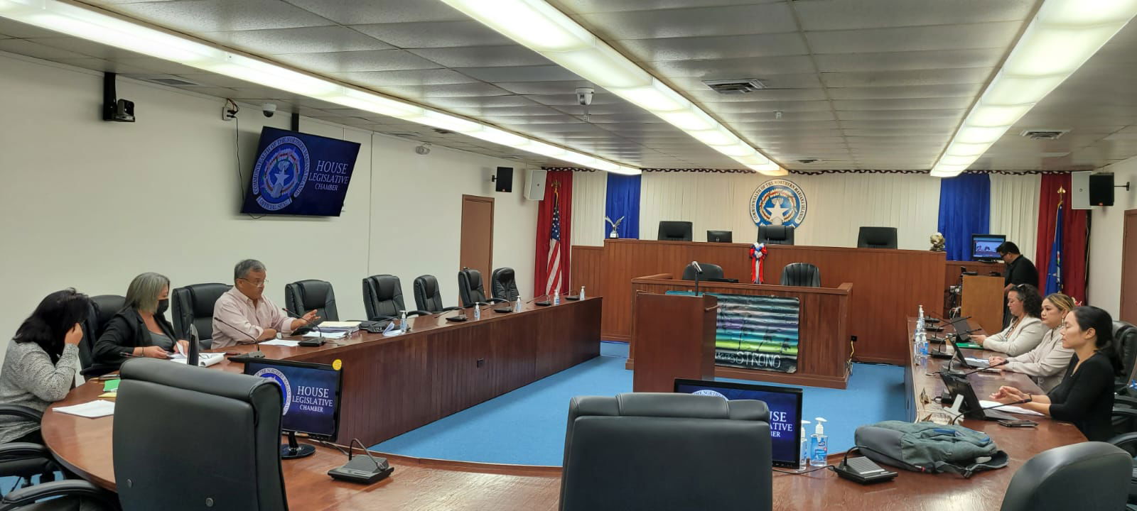 Sens. Teresita Santos, Ind.-Rota; Edith Deleon Guerrero, D-Saipan; and Paul A. Manglona, Ind.-Rota meet with Reps. Leila Staffler, D-Saipan; Corina Magofna, Ind.-Saipan; and Tina Sablan, D-Saipan in the House chamber on Monday morning.
