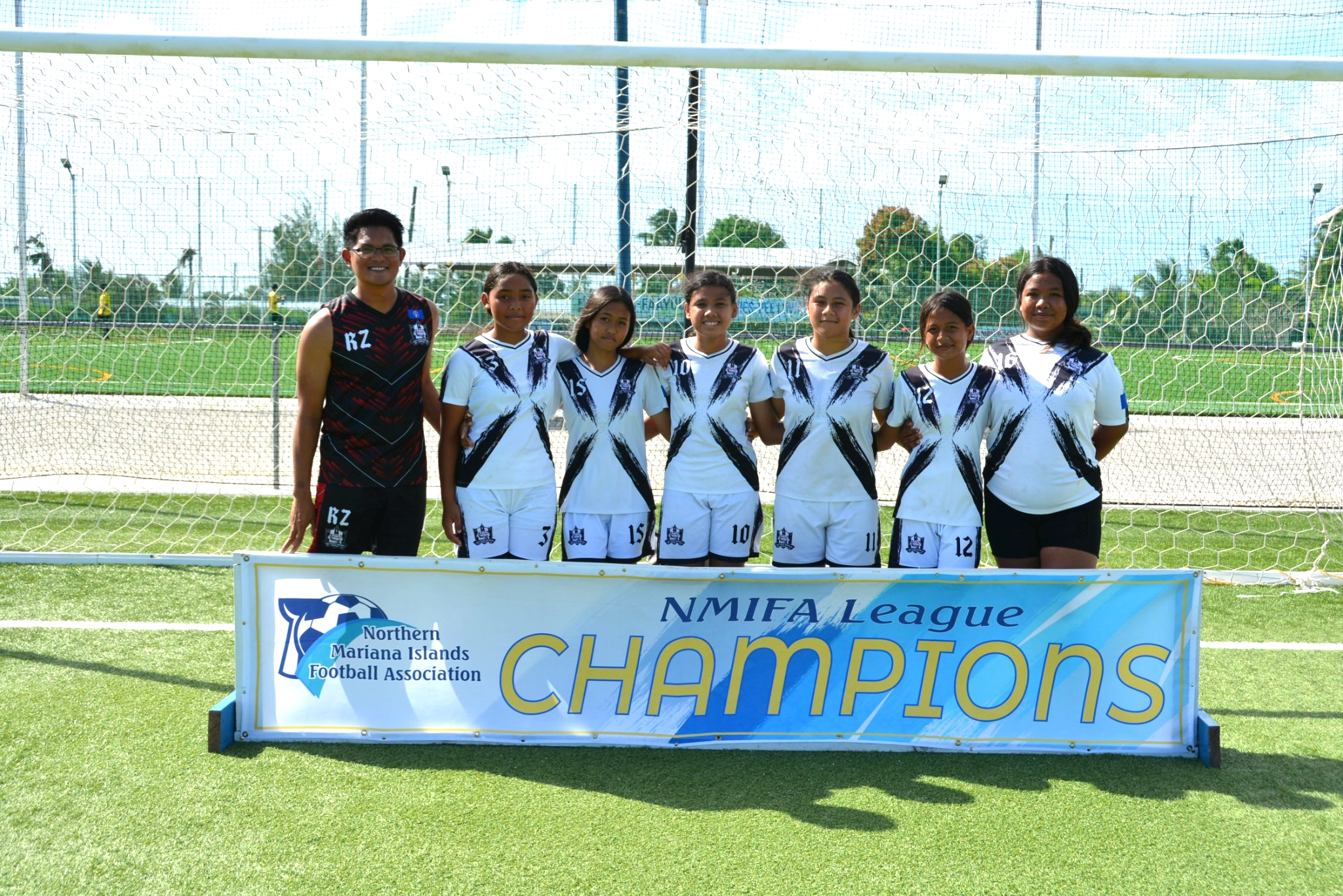 The Southern United Football Club members pose for a photo after beating the Paire Football Club  in the U13 girls division finale of the TakeCare Youth Soccer League at the NMI Soccer Training Center on Saturday.