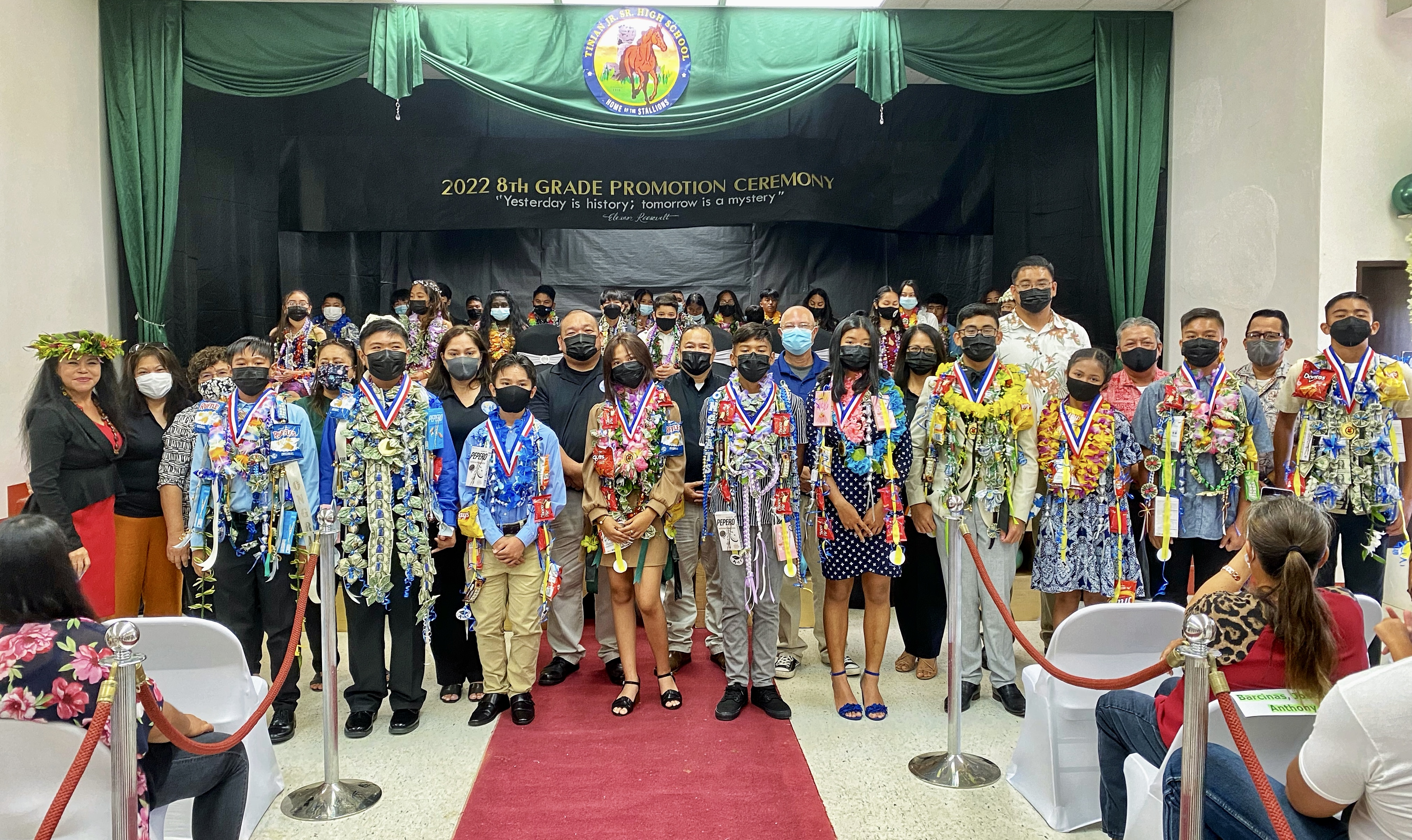 Tinian Jr. High School’s top 10 eighth graders: Edmar Timothy Mangubat Tirona, valedictorian; Geremy Lim Santos, salutatorian; Dylan Calibao Subia (3); Isa Mina Rodriguez Dosalua (4); Ha’nai Darence Dela Cruz Palacios (5); Angelica Joy Sosa Reyes (6); Adriel Roy Fabreag Lenteja (7); Dawn Princess Borja Flores (8); Brandon Jay Cruz Cepeda (9), and Jasper Manibusan Borja, Jr. (10). Also in photo are Board of Education Chairman Gregory Pat Borja, Vice Chairman Antonio L. Borja, Secretary/Treasurer Maisie B. Tenorio, Commissioner of Education Dr. Alfred B. Ada,  Principal Lizabeth Hofschneider and Vice Principal Nikita Mendiola.