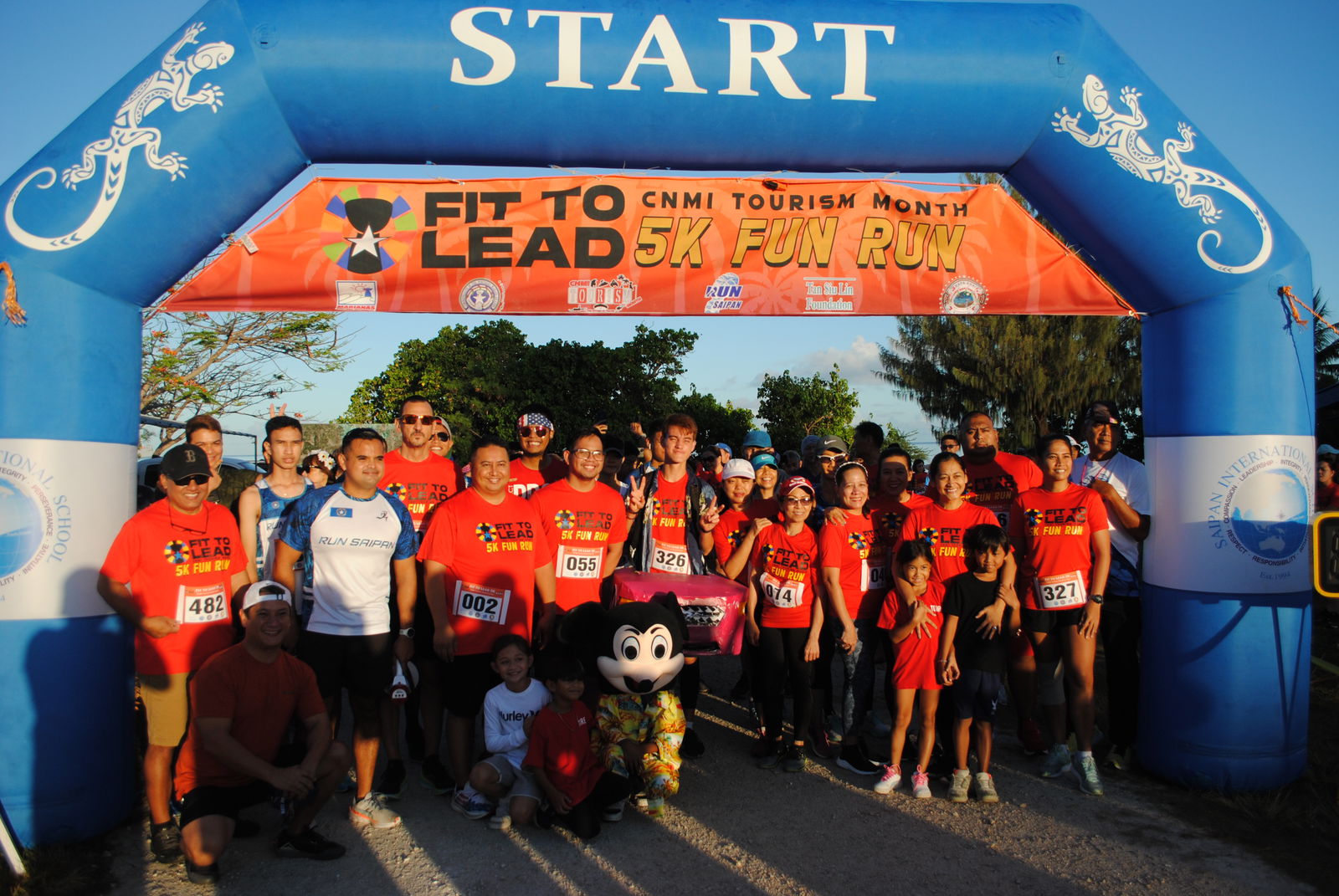 Gov. Ralph DLG Torres poses with his family and the other participants of the Fit to Lead 5K Tourism Month Fun Run  at the starting line in Garapan Saturday.