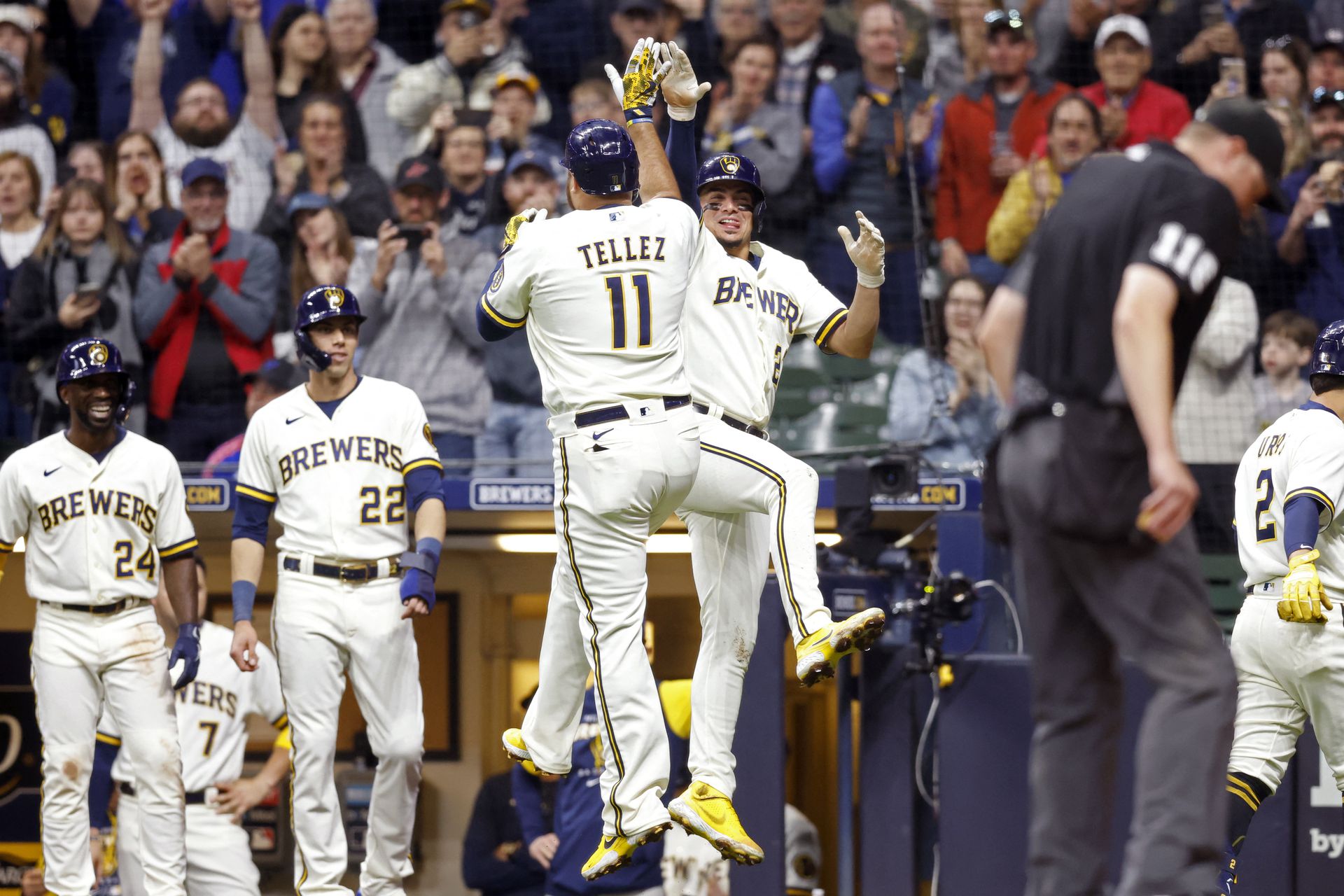 Milwaukee Brewers first baseman Rowdy Tellez (11) celebrates with shortstop Willy Adames (27) after hitting a grand slam home run during the third inning against the Cincinnati Reds at American Family Field in Milwaukee, Wisconsin on  May 4, 2022.
