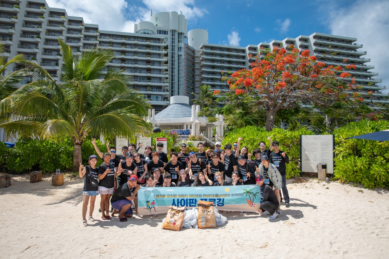 Kensington Hotel Saipan employees and guests pose for a photo following a beach cleanup on Friday, May 20.