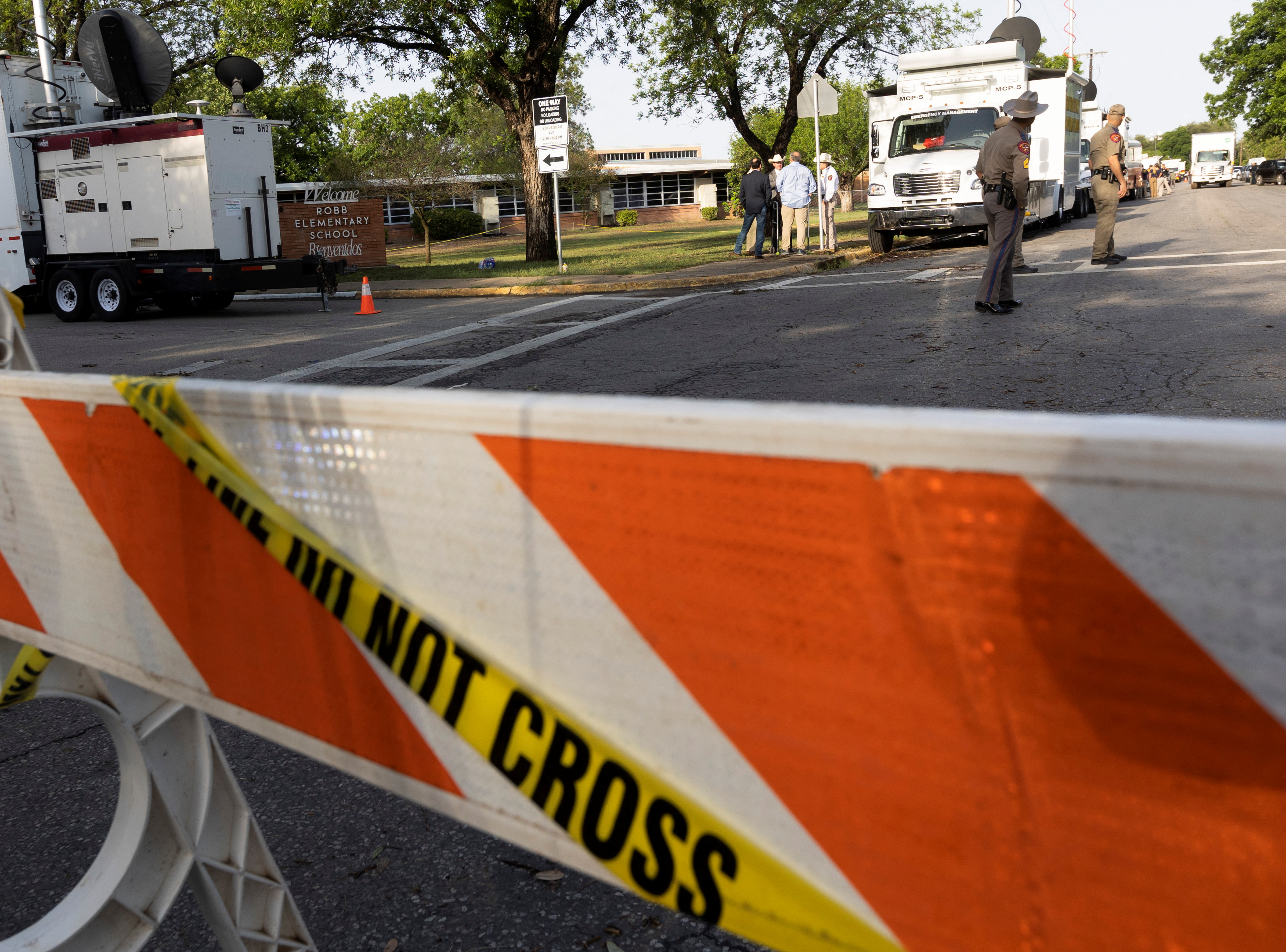 Law enforcement personnel investigate the scene at Robb Elementary School, the site of a mass shooting in Uvalde, Texas, May 25, 2022.
