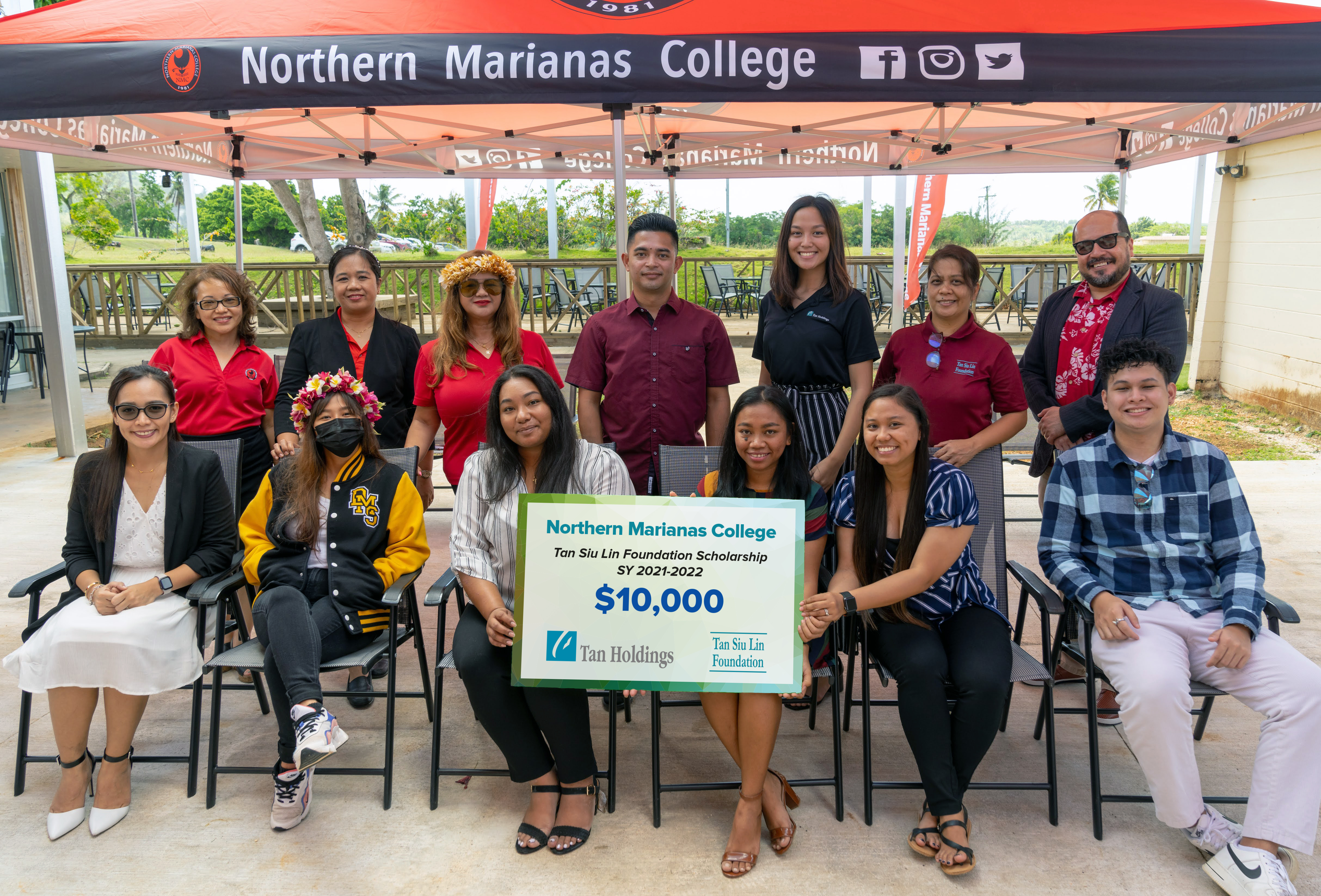 Top row: Northern Marianas College Financial Aid Office Director Daisy Manglona-Propst, NMC Interim Dean for Academic Programs and Services Vilma Reyes, NMC Dean for Student Support Services Charlotte Cepeda, Tan Siu Lin Foundation assistant manager Raymond Zapanta, administrative assistant to Tan Holdings CEO Hannah Santos, TSL Foundation administrative officer Rina Robles, and NMC President Galvin Deleon Guerrero, EdD. Bottom row: Tan Siu Lin Foundation 2021-22 scholarship recipients Jamerie Paras, Victoria Matsunaga, Charlotte Flores, Jessy Lou Lizama, Mary Deala, and Edieson Aguirre.