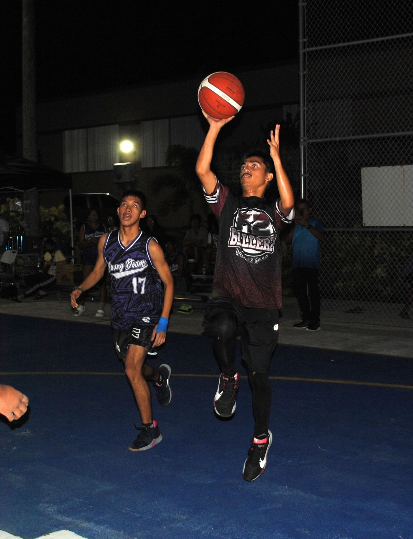 Jay Art Palmes attempts the floater during  the championship game of the P5 Hoops & Vibes Basketball Tournament at the Kagman Community Center basketball court on Saturday.