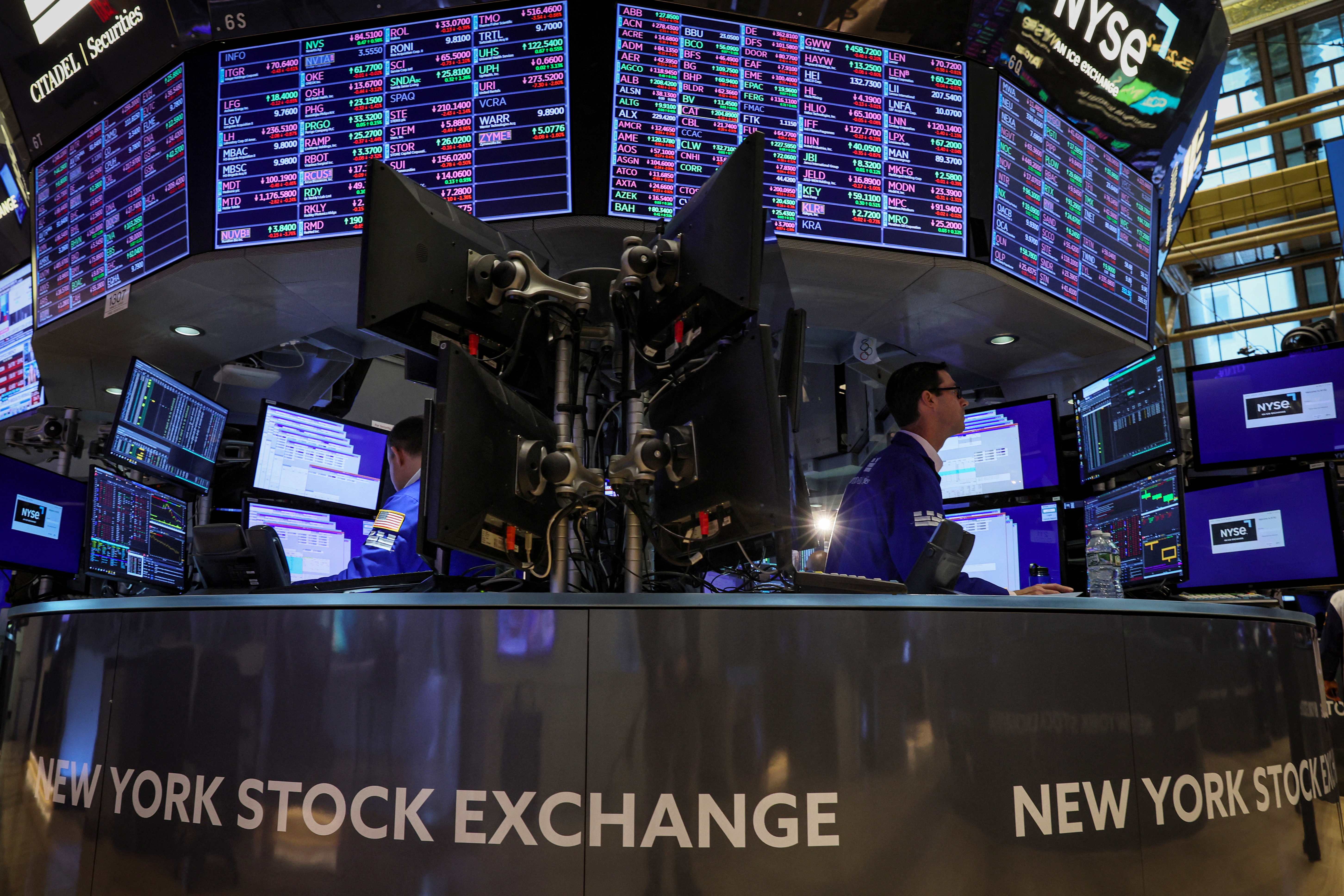 Traders work on the floor of the New York Stock Exchange in New York City, May 12, 2022.