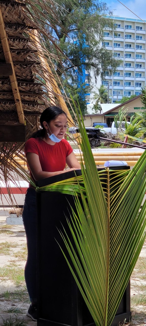 Student Carmelita P. Castro reads the proclamation.