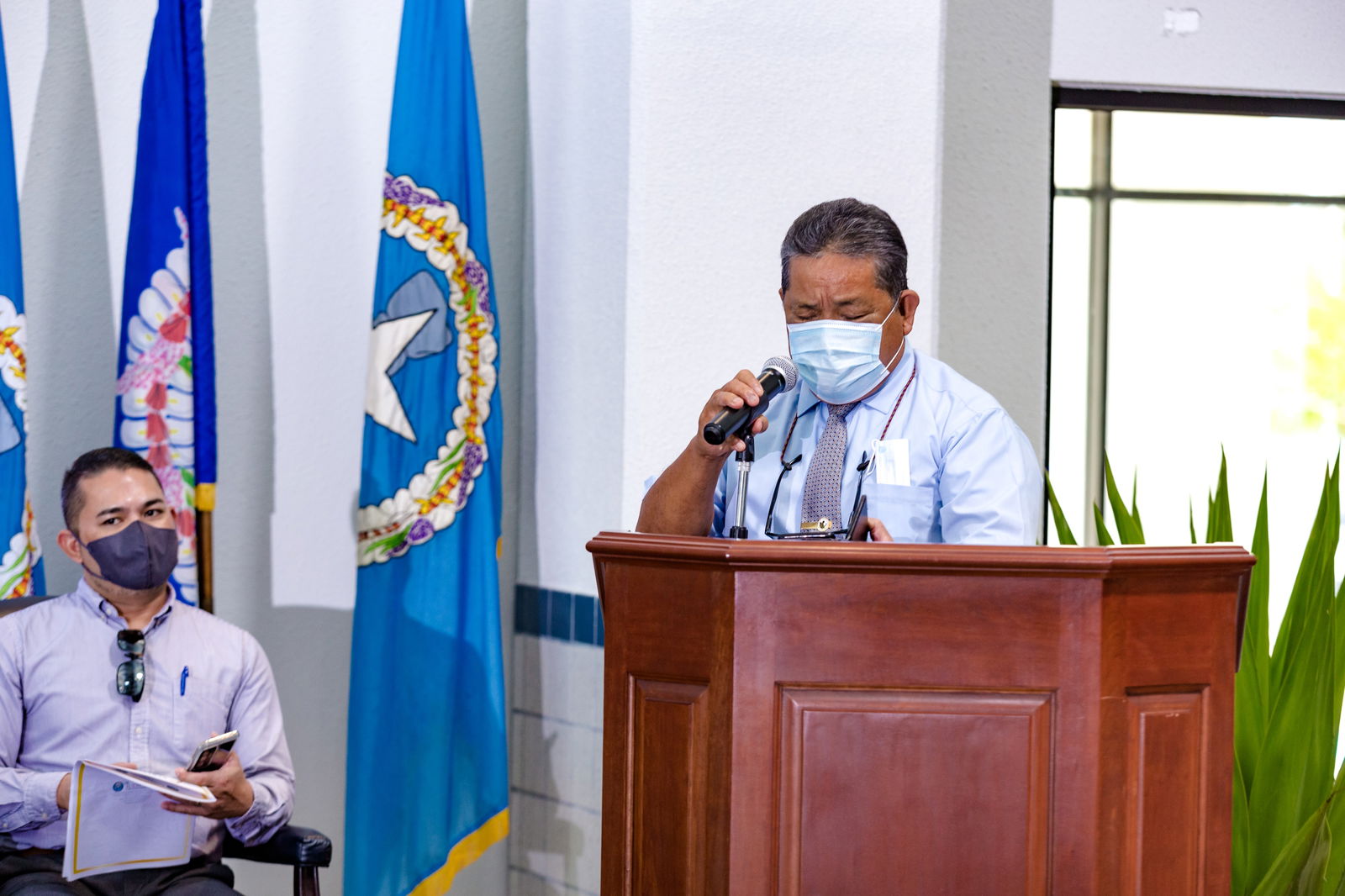 Chief Justice Alexandro Castro, right, delivers his remarks while Senate Floor Leader Vinnie F. Sablan listens.