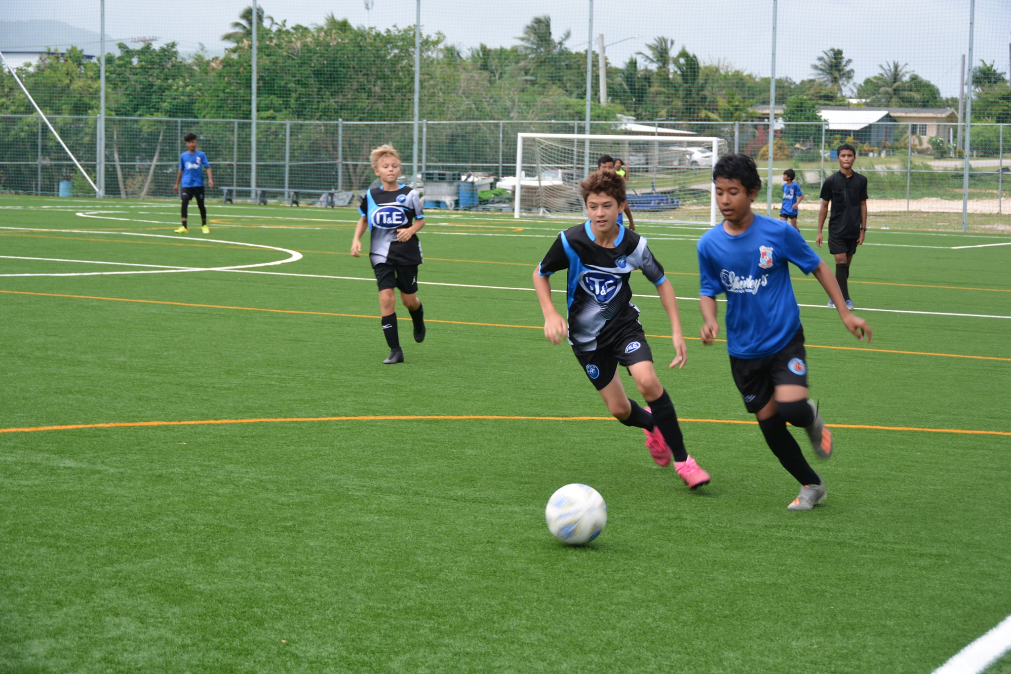MP United Pink's Michael Miller chases after the ball during a game against Shirley’s in the U13 boys division of the TakeCare Youth Soccer League at the NMI Soccer Training Center.