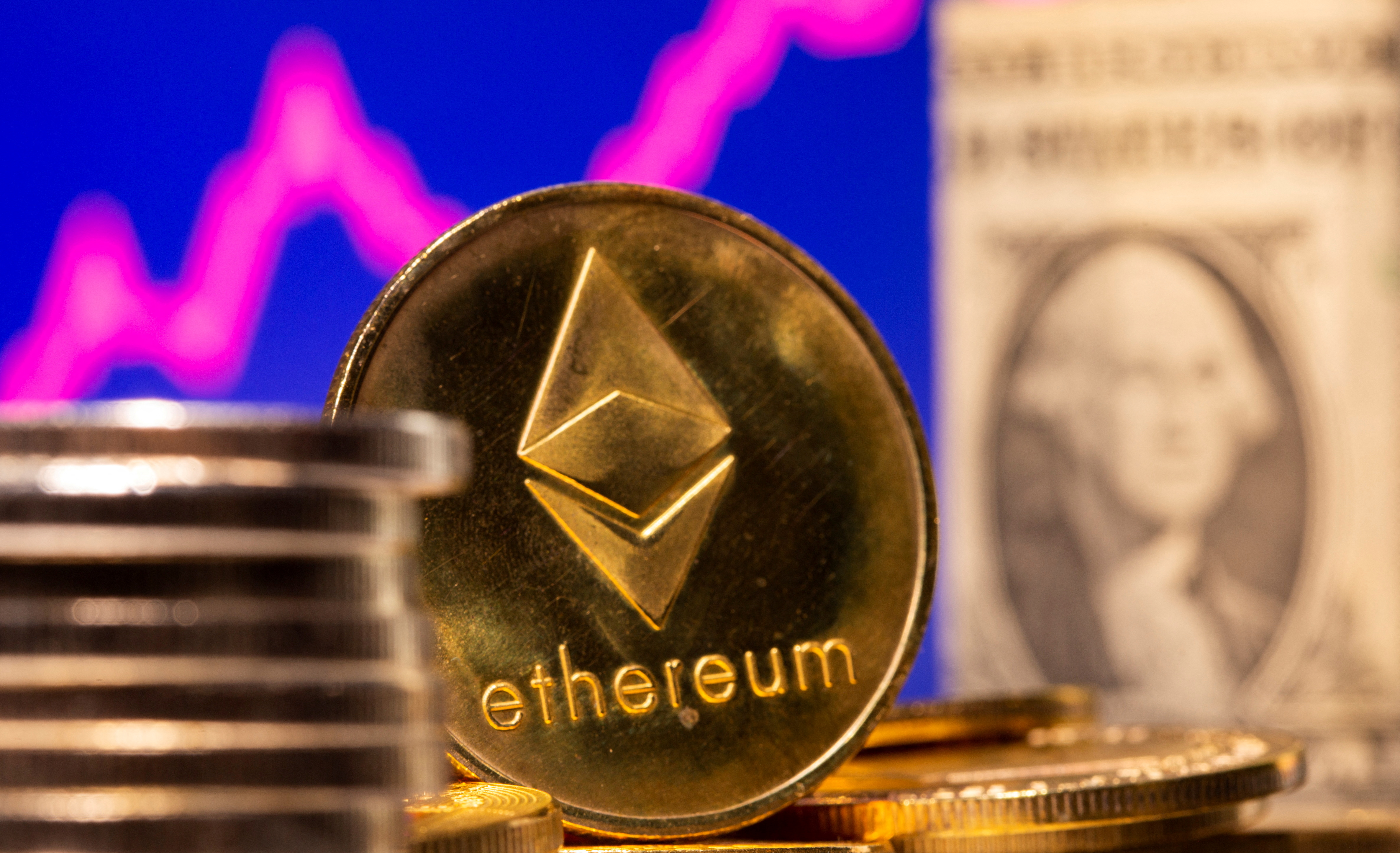 A representation of virtual currency Ethereum and a U.S. One Dollar banknote are seen in front of a stock graph in this illustration taken Feb. 19, 2021.