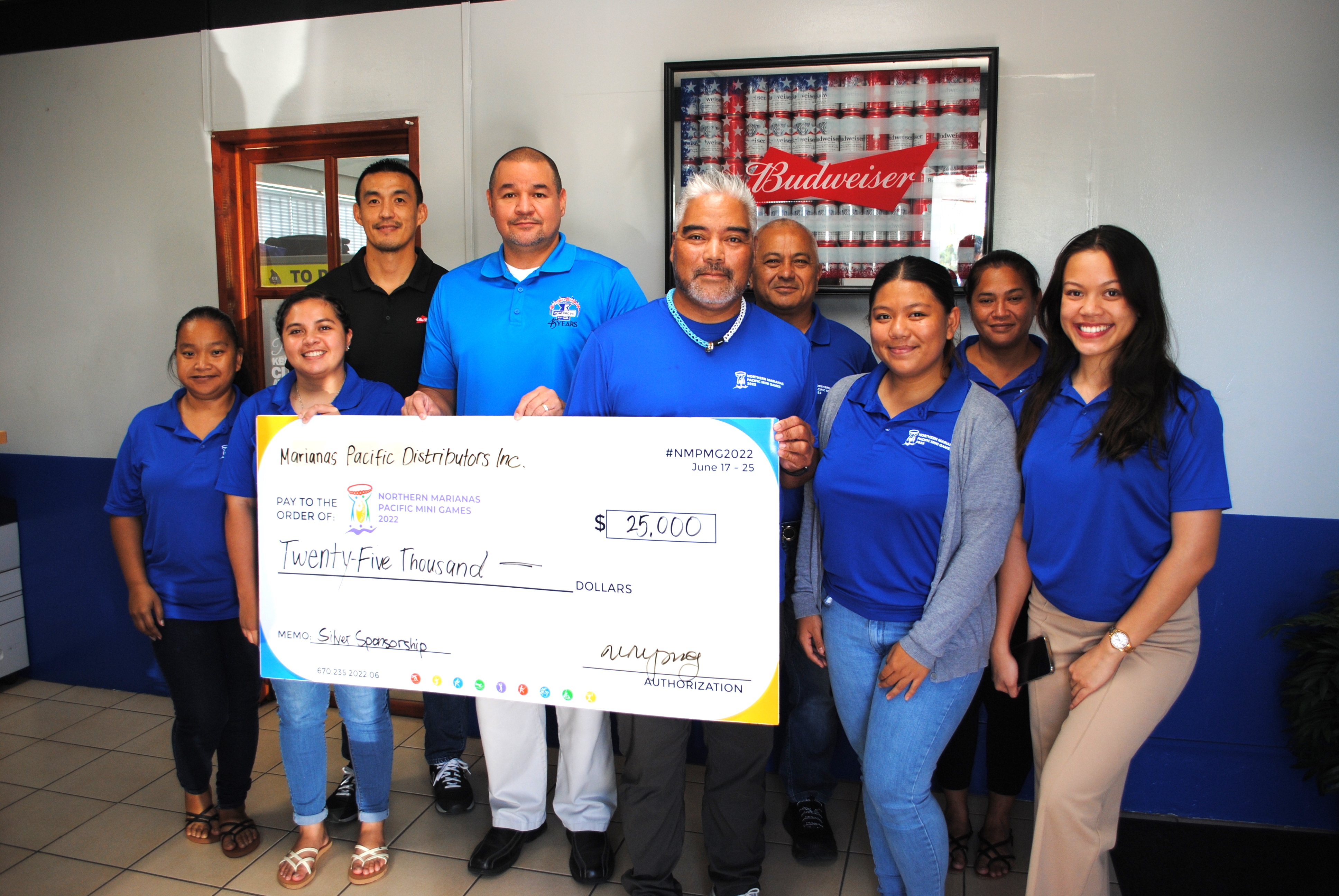 Marpac Sales Manager James Lee, third left, and General Manager Guy Pudney pose for a photo with 2022 Pacific Mini Games Organizing Chairman Marco Peter, CEO Ben Babuata and the rest of the committee members at the Marpac office in Gualo Rai on Tuesday. Marpac donated $25,000 to  the organizing committee.