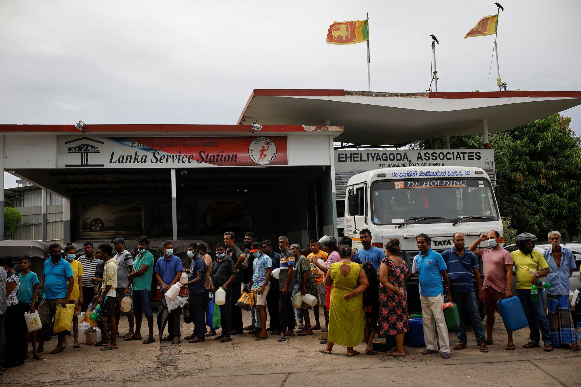 People wait in a queue to buy petrol at a fuel station, amid the country's economic crisis in Colombo, Sri Lanka, May 16, 2022.