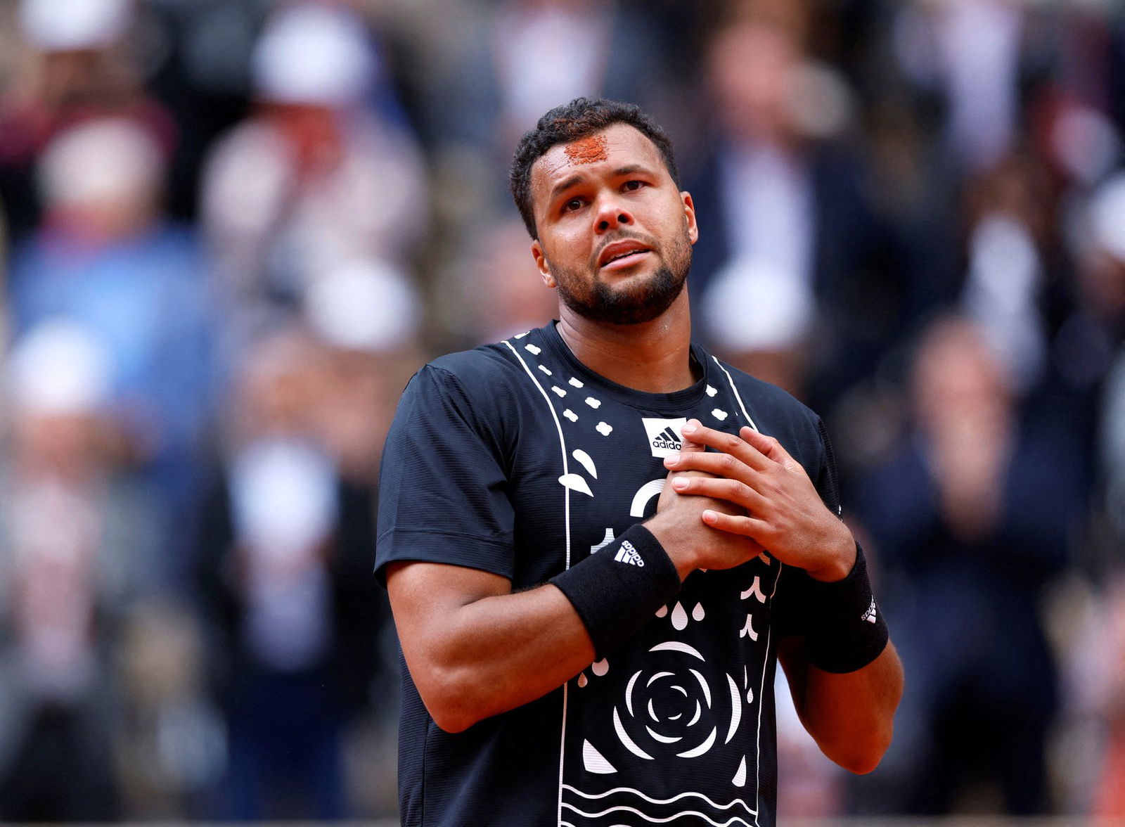 France's Jo-Wilfried Tsonga reacts after playing his final match before retiring, after losing his first round match against Norway's Casper Ruud in the French Open at Roland Garros, Paris, France on May 24, 2022.