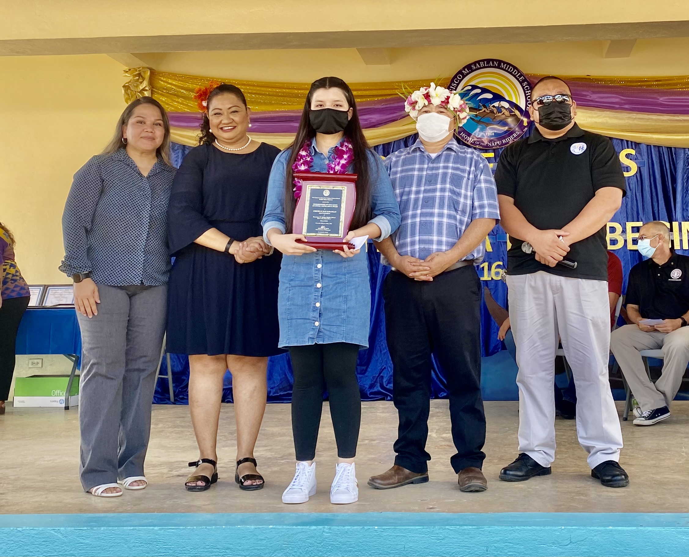 FMS Class salutatorian was Chenille Rys Sabangan receives the Commissioner of Education Award from Commissioner of Education Dr. Alfred Ada and Associate Commissioner Eric Magofna.  Also in photo are FMS Principal Cherlyn Osung and Vice Principal Carla Sablan.