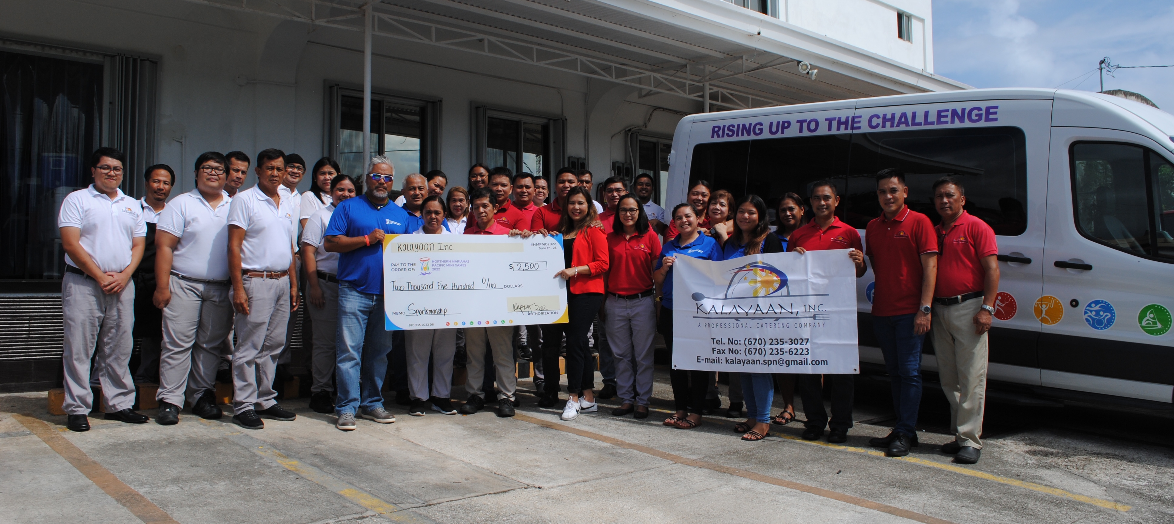 Kalayaan Inc. President Eleanor Alinas, center, and her staff pose with  Northern Marianas Pacific Mini Games 2022 Organizing Committee Chairman Marco Peter, CEO Ben Babauta and organizing committee members during a check presentation at the Kalayaan Inc. headquarters in San Antonio on Wednesday.