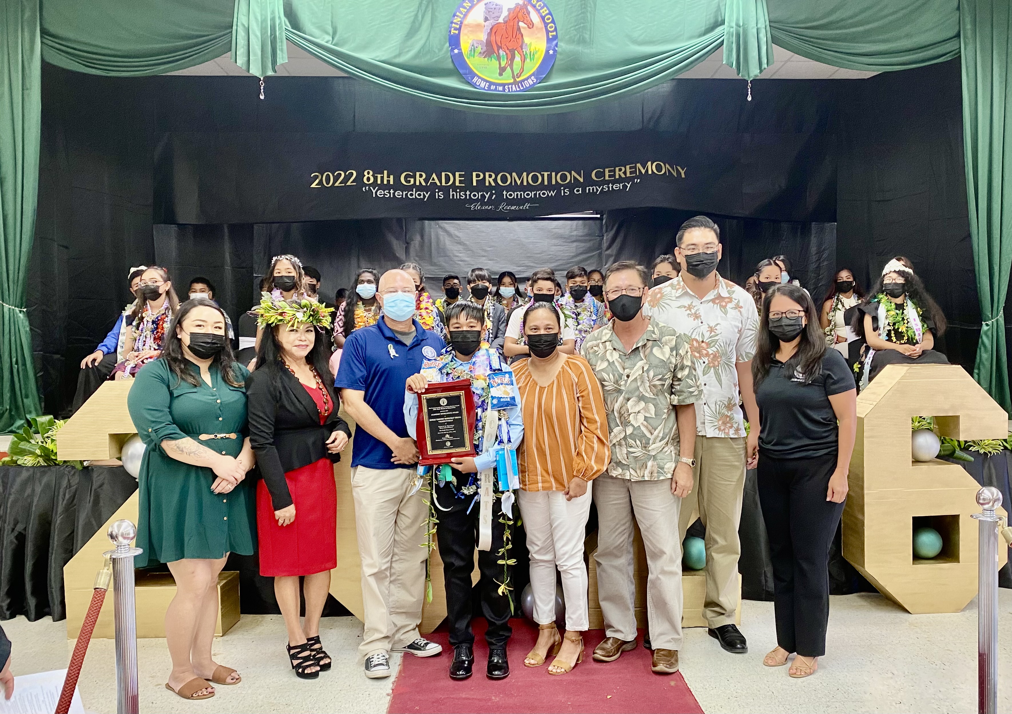 During the Tinian Jr. High School  promotion ceremony for eighth graders, the BOE Award was presented to valedictorian Edmar Timothy Mangubat Tirona by BOE Chairman Gregory Pat Borja, Vice Chairman Antonio L. Borja, and Secretary/Treasurer Maisie B. Tenorio. Also in photo are Tirona’s parent and school Principal Lizabeth Hofschneider and Vice Principal Nikita Mendiola.