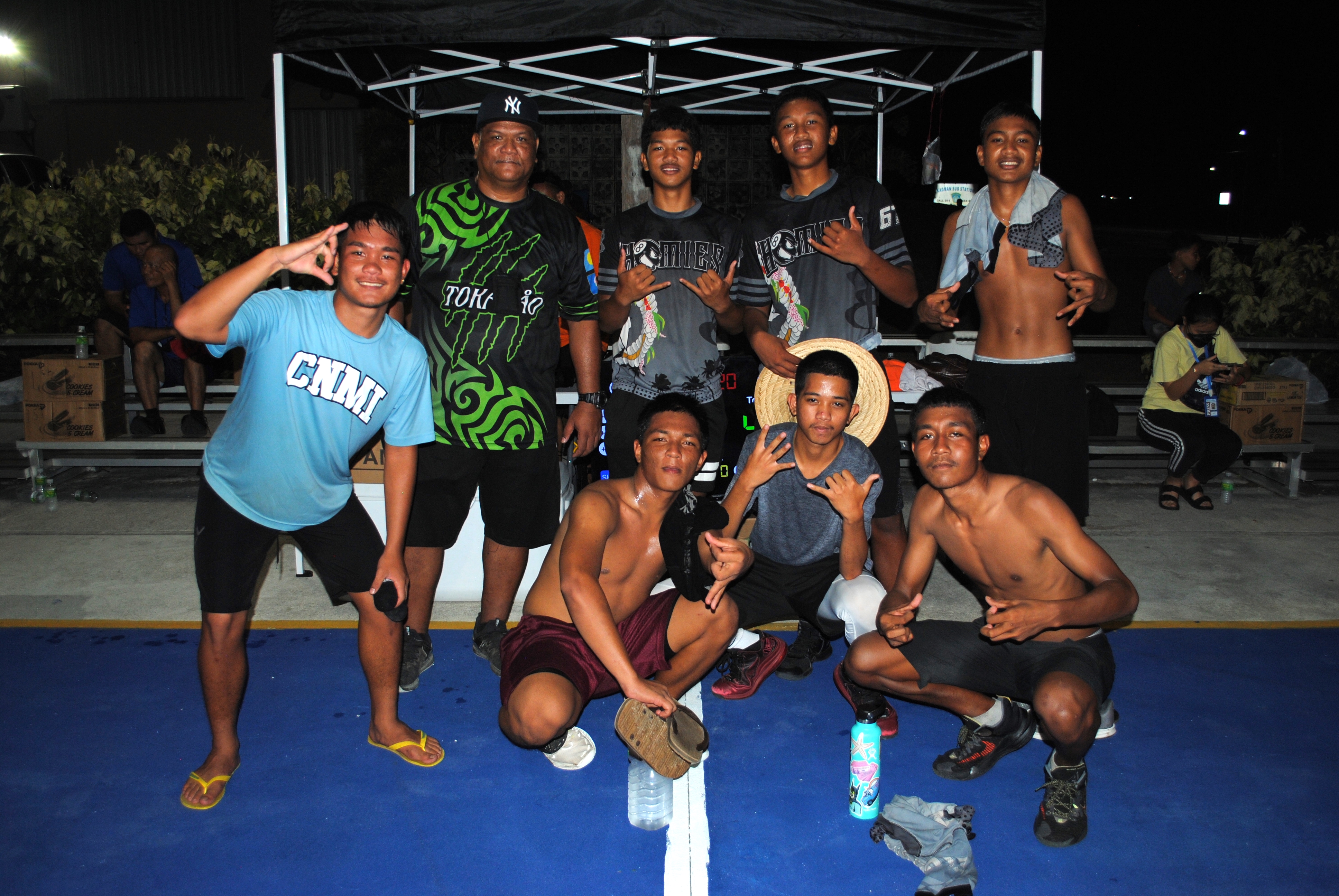 The Homies pose with the  4th place trophy.