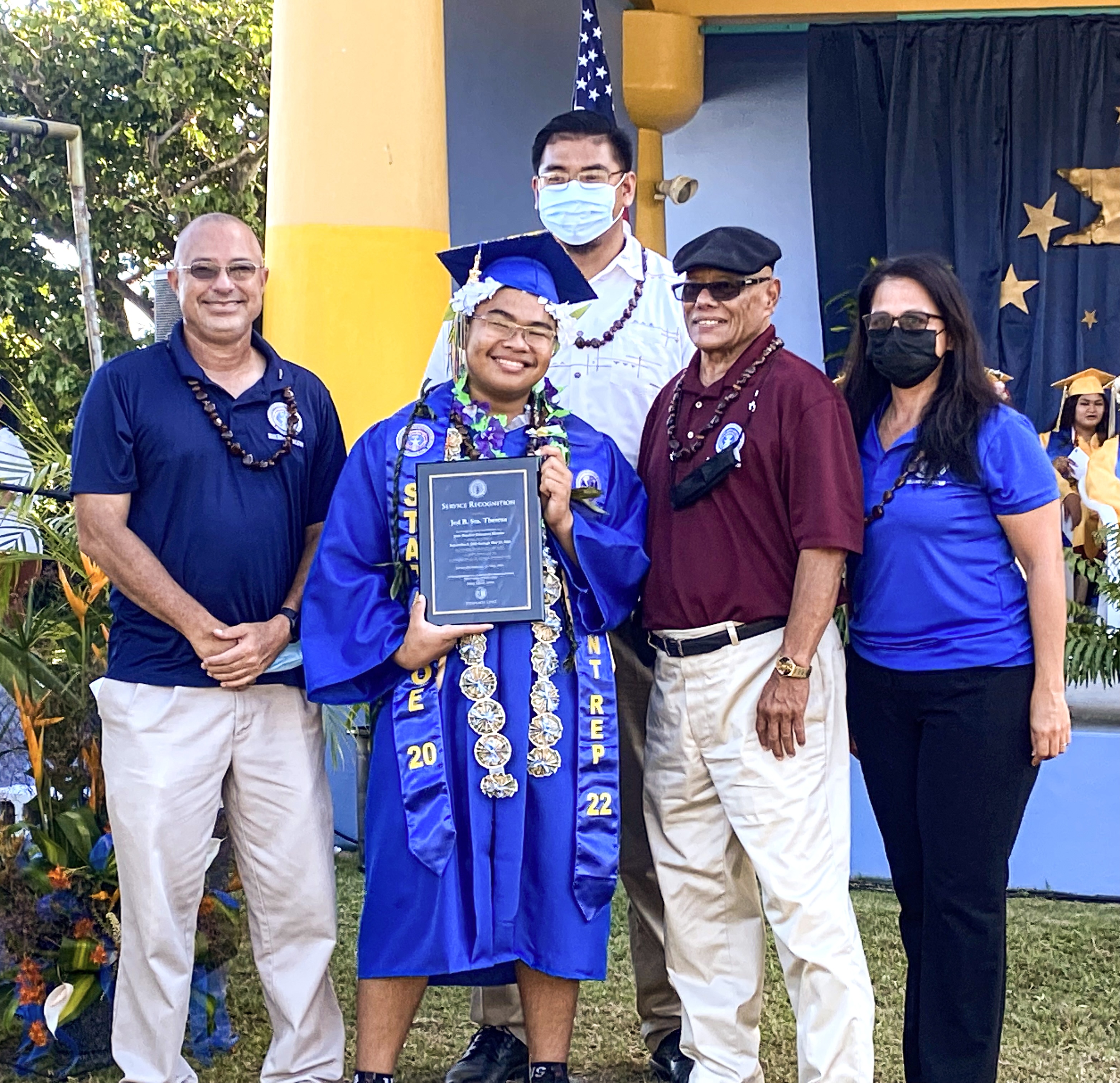 Graduating senior Jed Sta. Theresa is  presented with the Board of Education Service Award for serving as the BOE student representative. Also in photo are BOE Chairman Gregory Pat Borja, Vice Chairman Antonio L. Borja, Secretary-Treasurer Maisie B. Tenorio and Board Member Herman Atalig.