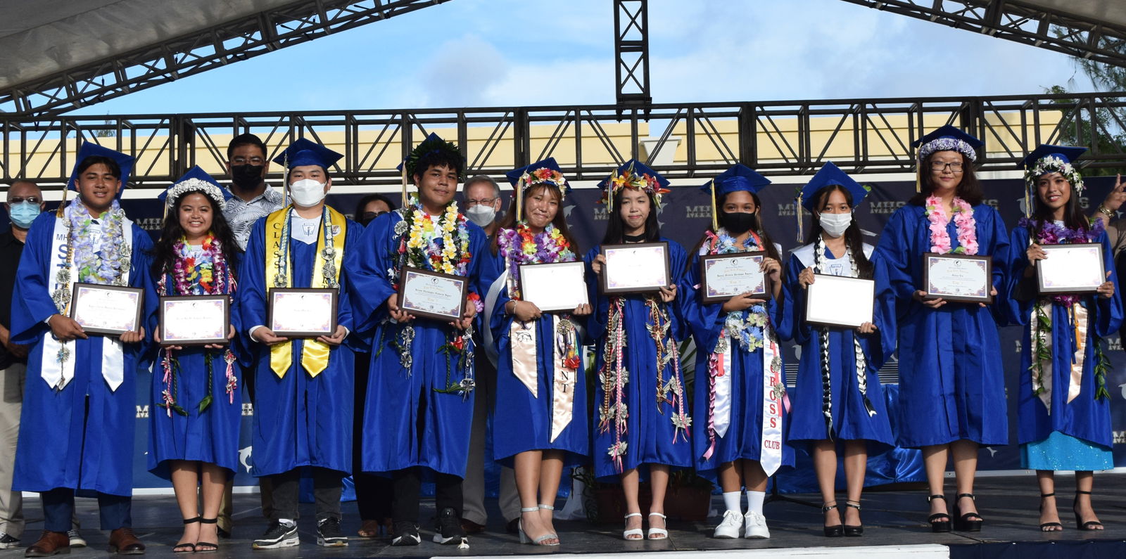 The MHS Class of 2022’s Top 10 students, from left: Jigger Zyrus Manalo Parayaoan,  Lizzie Joy Del Rosario Manabat, Seung Won Lee, Jerawn Christopher Camacho Joyner, Arisa Iseyama Custodio,  Shu Qi Wu, Joanah Victoria Bartolome Jimenez,  Jieun Yang, Vivien Liu and Perpetua Jasmine Magcalas Garcia. Also in photo are Board of Education Chairman Gregory Borja, BOE members Antonio Borja, Maisie Tenorio, and Ron Snyder, non-public school representative.