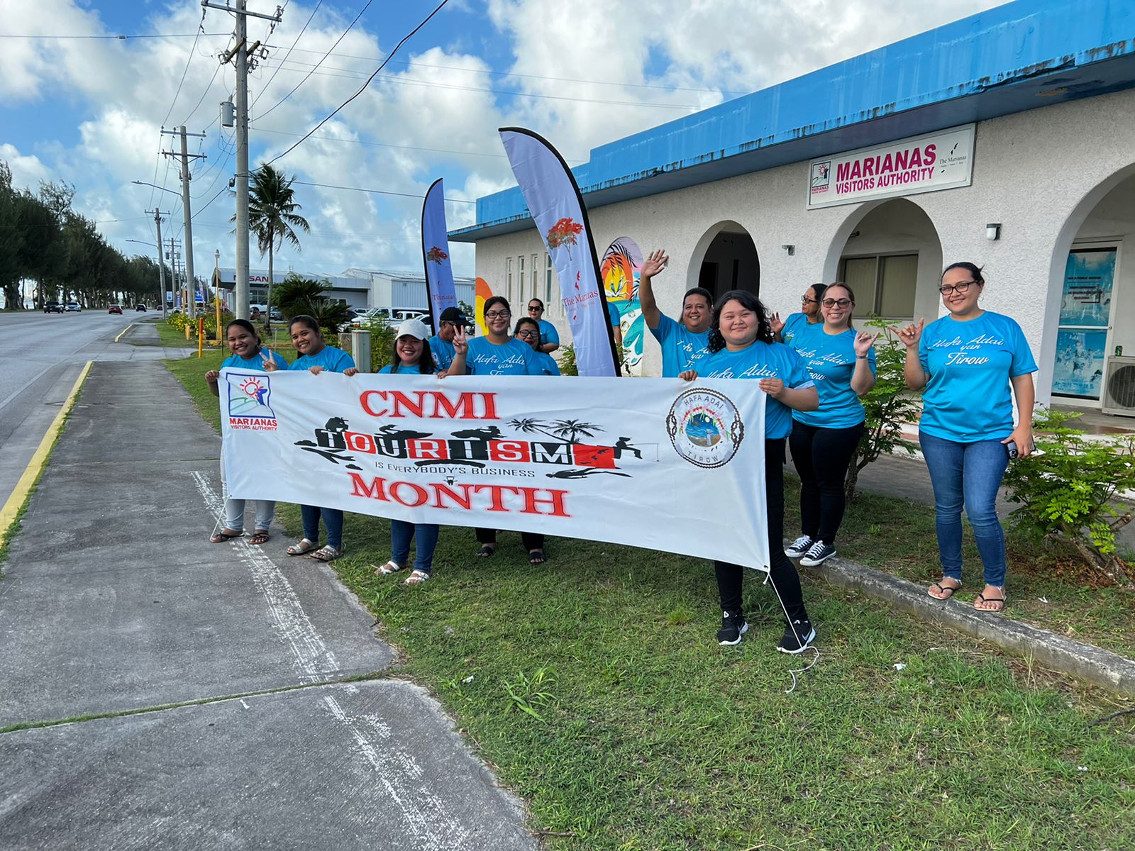 Management and staff of the Marianas Visitors Authority wave in support of Marianas Tourism Month on March 6, 2022, at the MVA office in San Jose, Saipan.