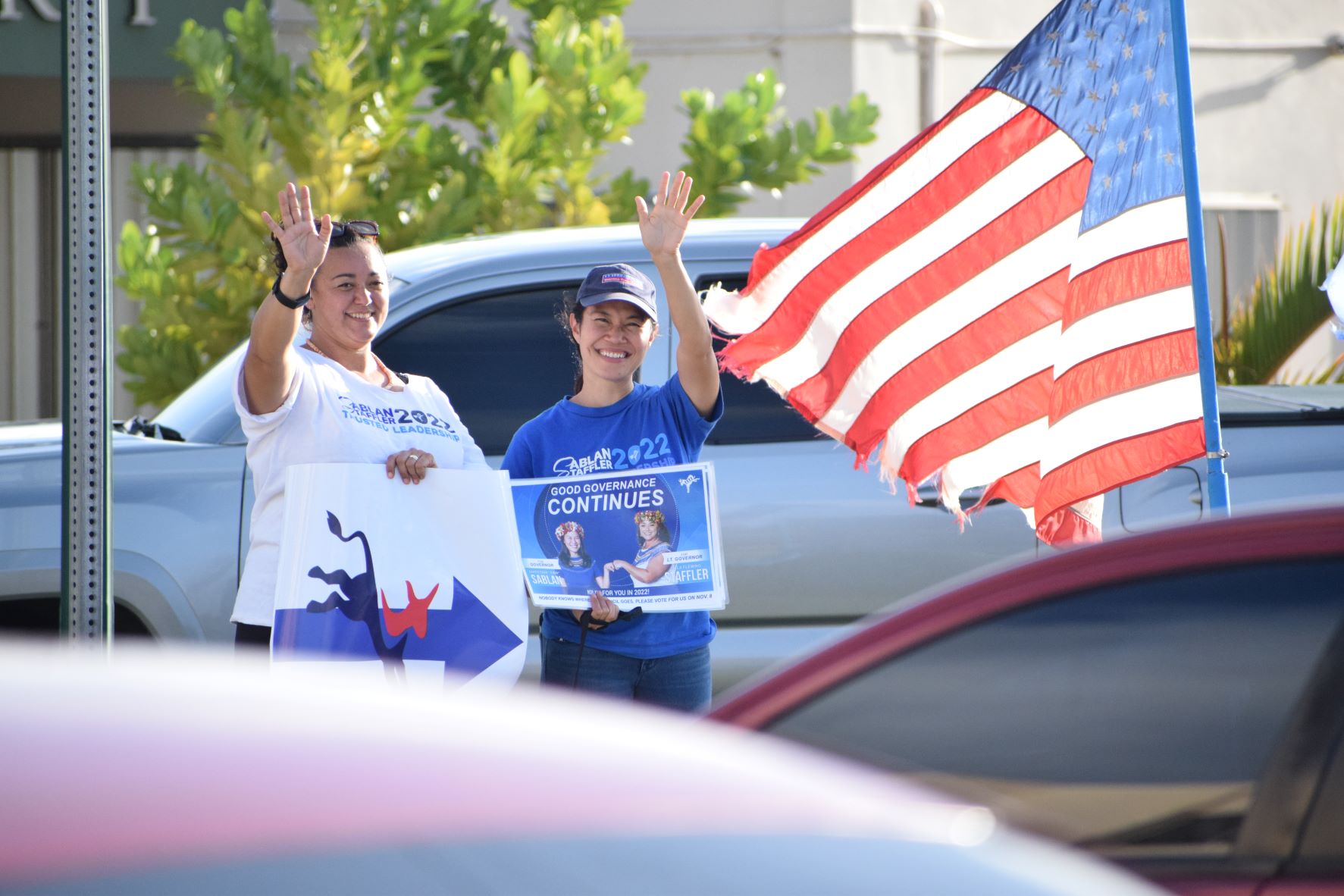 The NMI Democratic Party gubernatorial candidate Rep. Tina Sablan and her running mate, Rep. Leila Staffler, greet motorists during a road-waving activity at the Garapan Fishing Base on Friday, April 29, 2022.