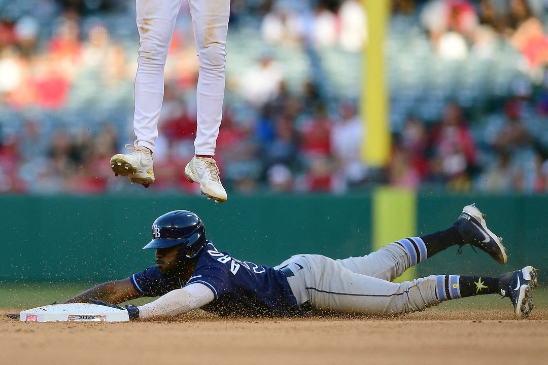 Tampa Bay Rays left fielder Randy Arozarena (56) steals second against Los Angeles Angels shortstop Tyler Wade (14) during the ninth inning at Angel Stadium in Anaheim, California on May 11, 2022.