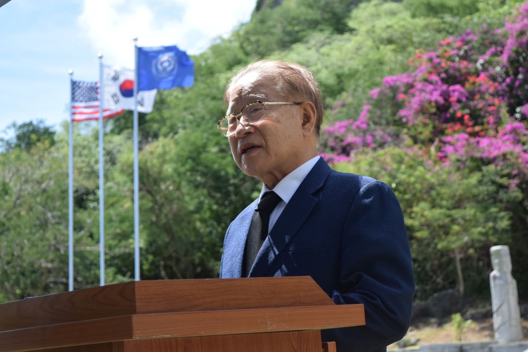 South Korea’s first minister of the Ministry of Communications, Dae Soon Lee, delivers his remarks at the Korean Peace Memorial in Marpi on Friday.