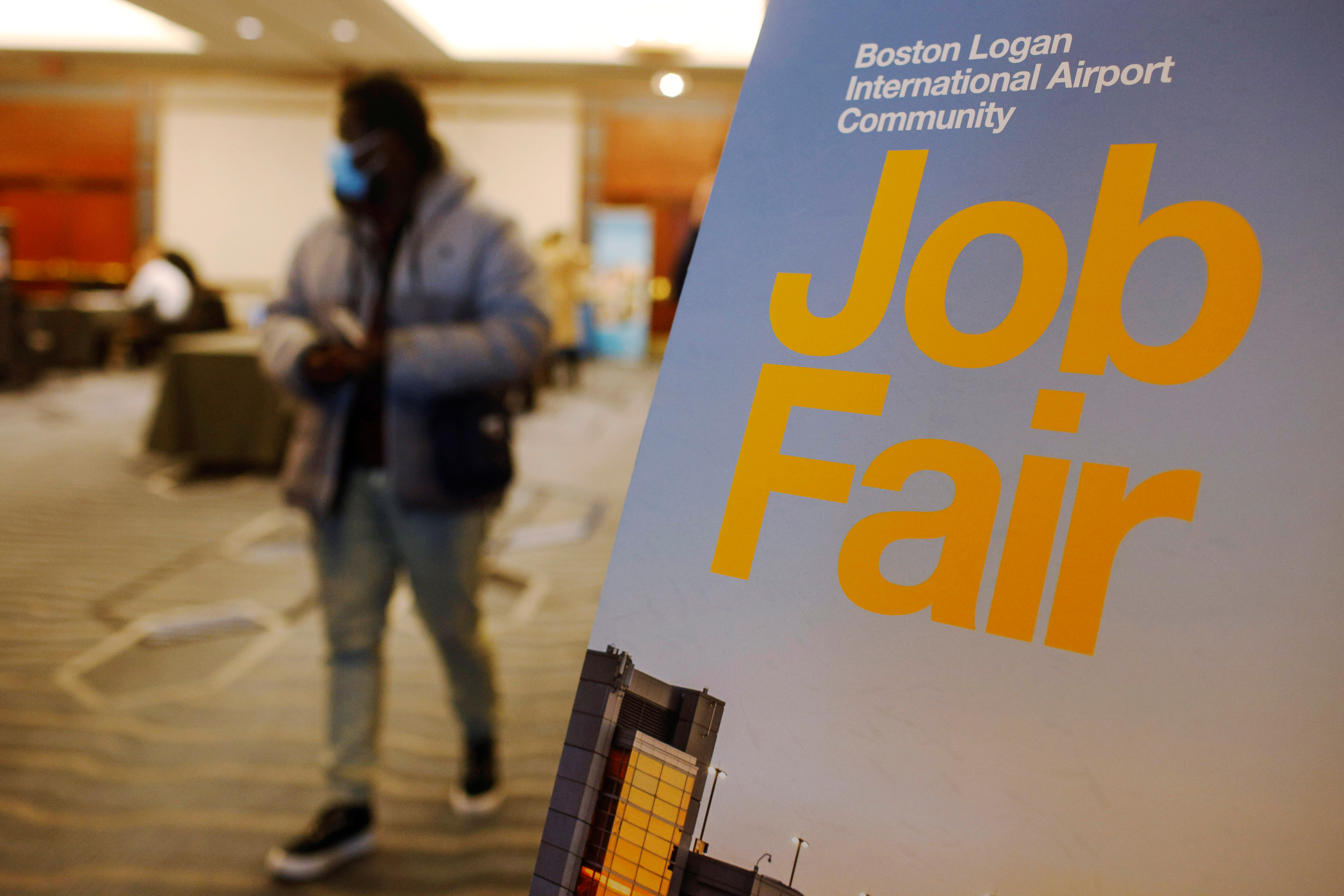 A job seeker leaves the job fair for airport related employment at Logan International Airport in Boston, Massachusetts on Dec. 7, 2021.