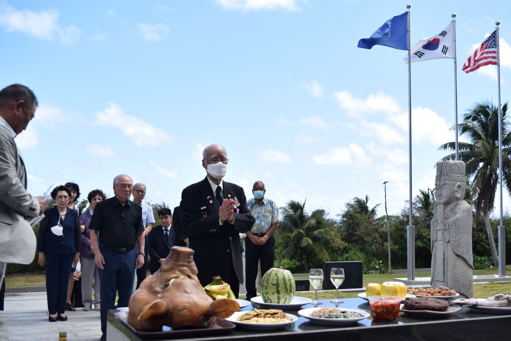 Yong Taek Lee, South Korea Public Administration honorary director and Memorial Service Association for the Deceased Compatriots Overseas chairman, offers prayer at the Korean Peace Memorial in Marpi on Friday. Also in photo are Saipan Mayor David M. Apatang, right, Korean Cultural Center chairman Kim Hong Gyun, left, and other visitors.