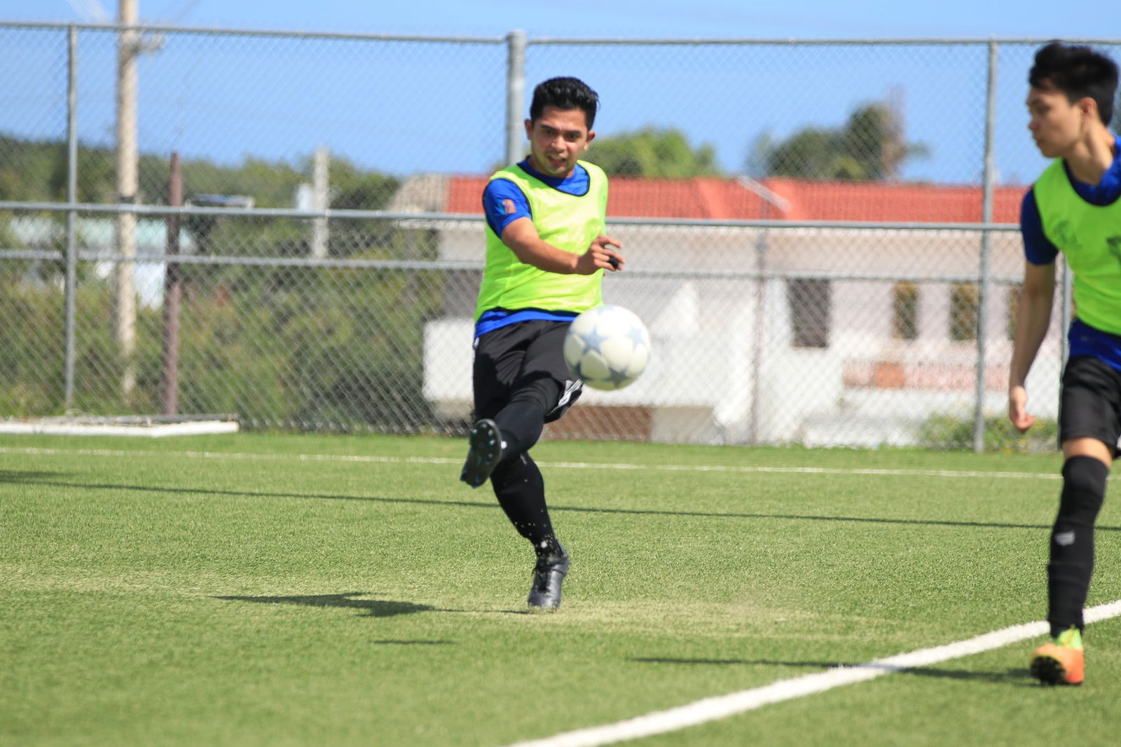 Old B Bank's Raymond Zapanta passes to a teammate ahead during a Men's Soccer League 2 game at the NMI Soccer Training Center.