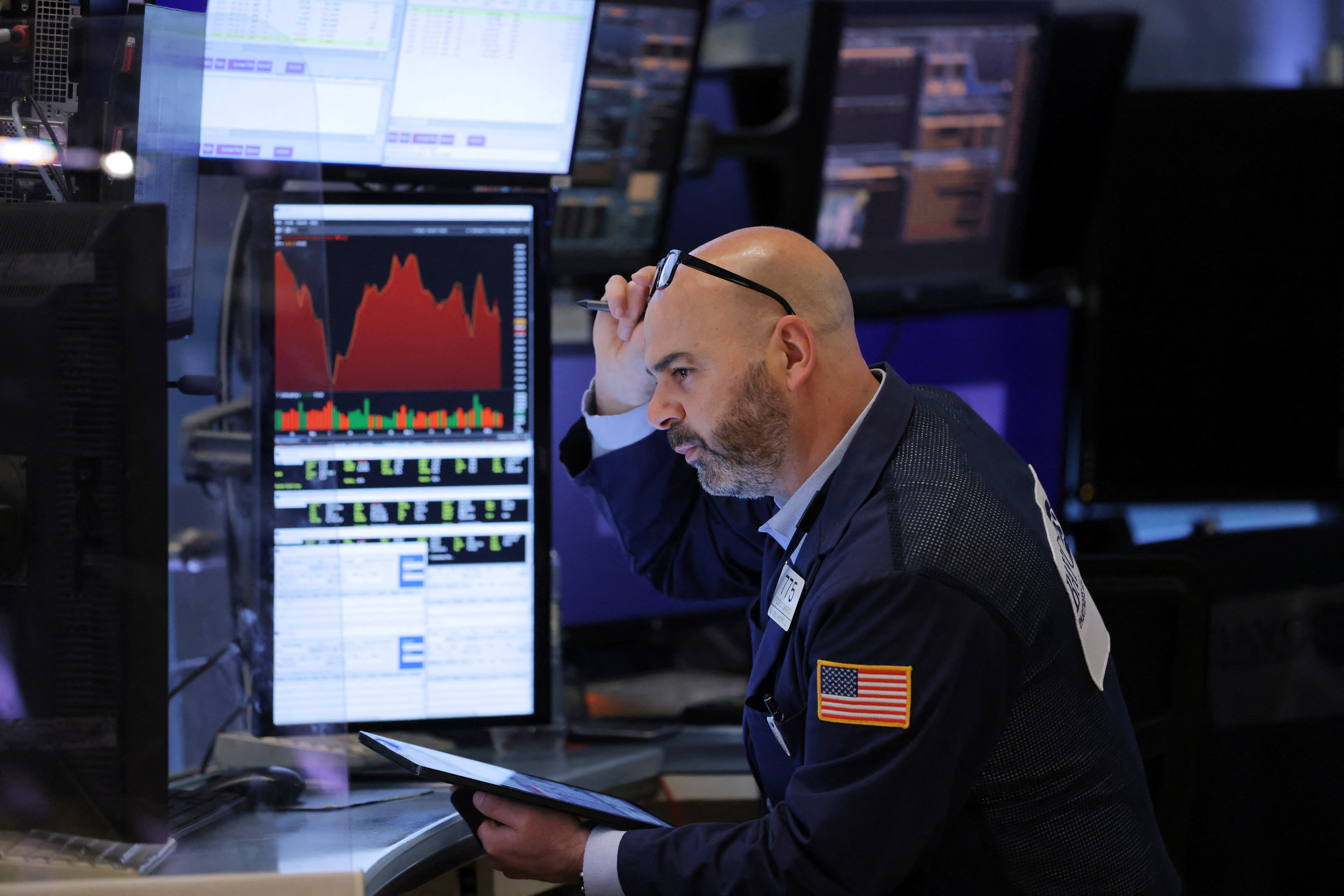 A trader works on the trading floor at the New York Stock Exchange in Manhattan on May 5, 2022.