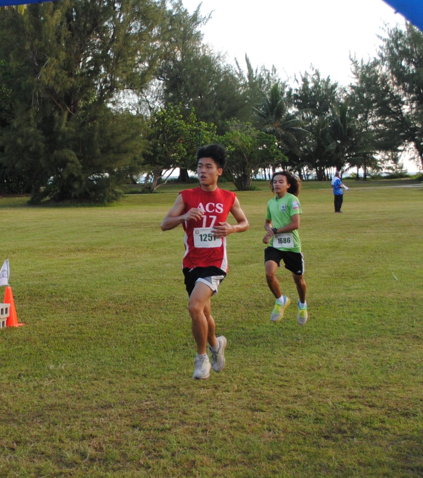 Eason Tang pushes through the finish line of the 2nd CNMI Star Wars Day Run on Saturday at American Memorial Park.