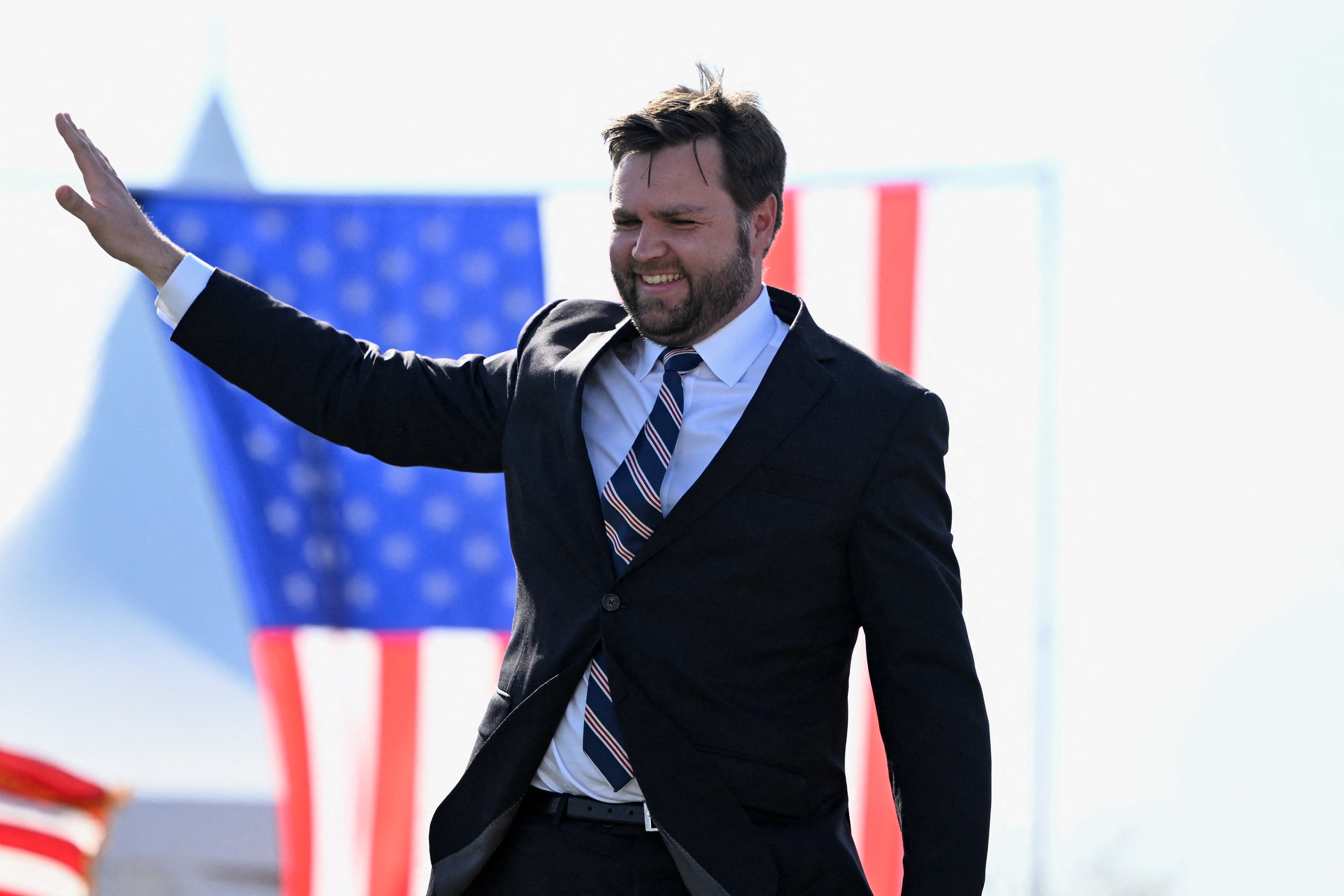 U.S. Senate Republican candidate J.D. Vance, who was endorsed by former President Donald Trump, gestures on stage during an event hosted by Trump, at the county fairgrounds in Delaware, Ohio, April 23, 2022.