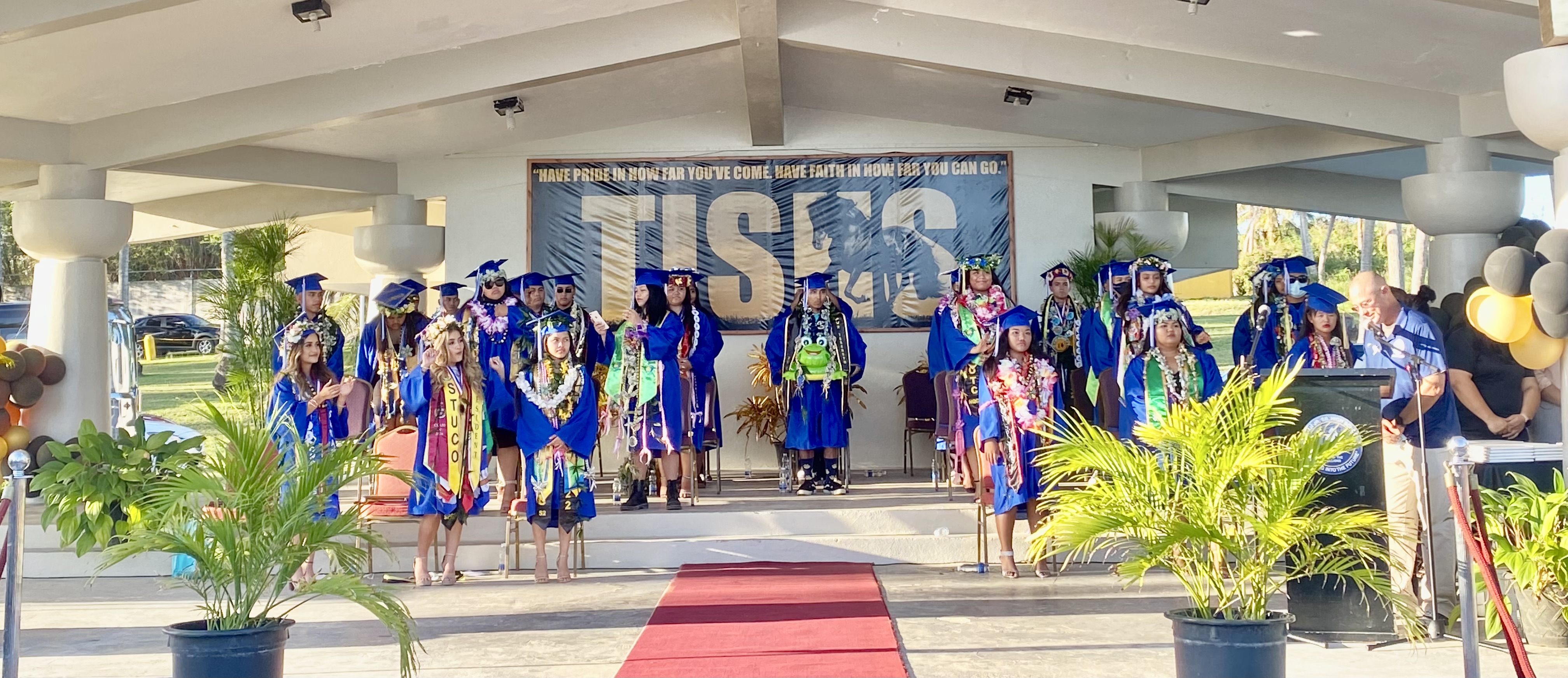 Board of Education Chairman Gregory Pat Borja, right, declares that the members of the Class of 2022 have graduated from high school.