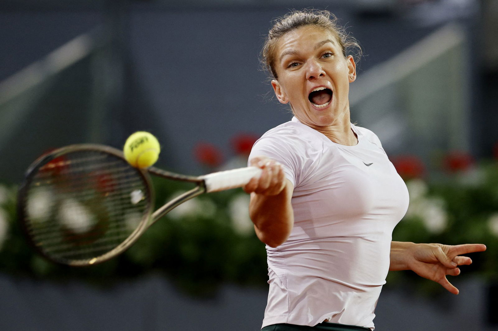 Romania's Simona Halep in action during her third round match against Coco Gauff of the U.S. at Caja Magica, Madrid, Spain on May 2, 2022.