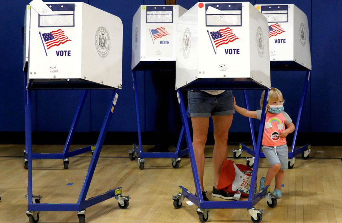 People fill out ballots during voting in the New York primary election at a polling site in the Brooklyn borough of New York City, June 22, 2021.