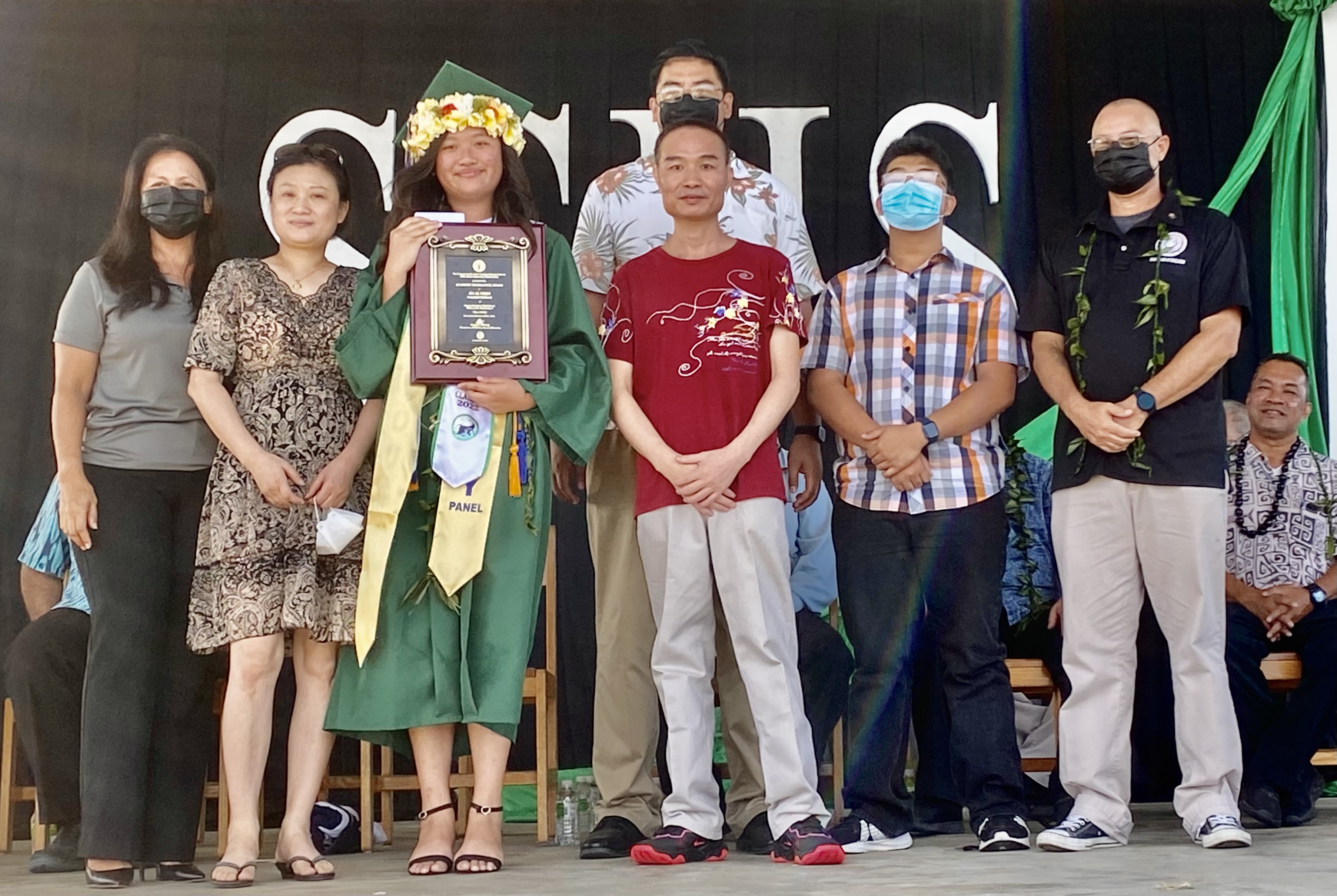 Valedictorian and Board of Education awardee Jia Li Chen, with her mother and father next to her, poses for a photo with BOE Chairman Gregory Pat Borja, Vice Chairman Antonio L. Borja, Secretary/Treasurer Maisie B. Tenorio and student representative Jed Sta. Theresa.
