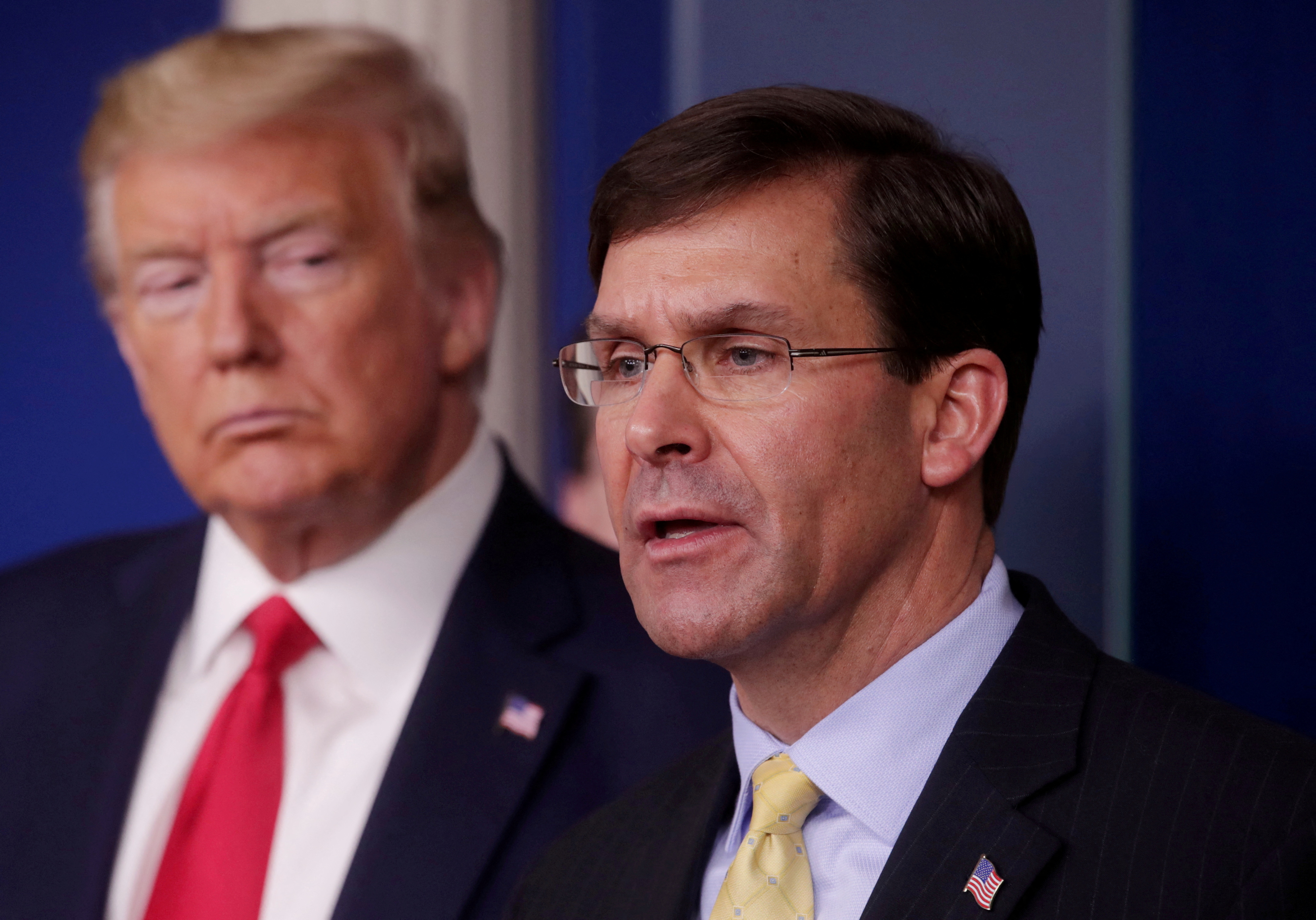 President Donald Trump listens to Secretary of Defense Mark Esper address the daily White House coronavirus response briefing with members of the administration's coronavirus task force at the White House in Washington, D.C. on March 18, 2020.