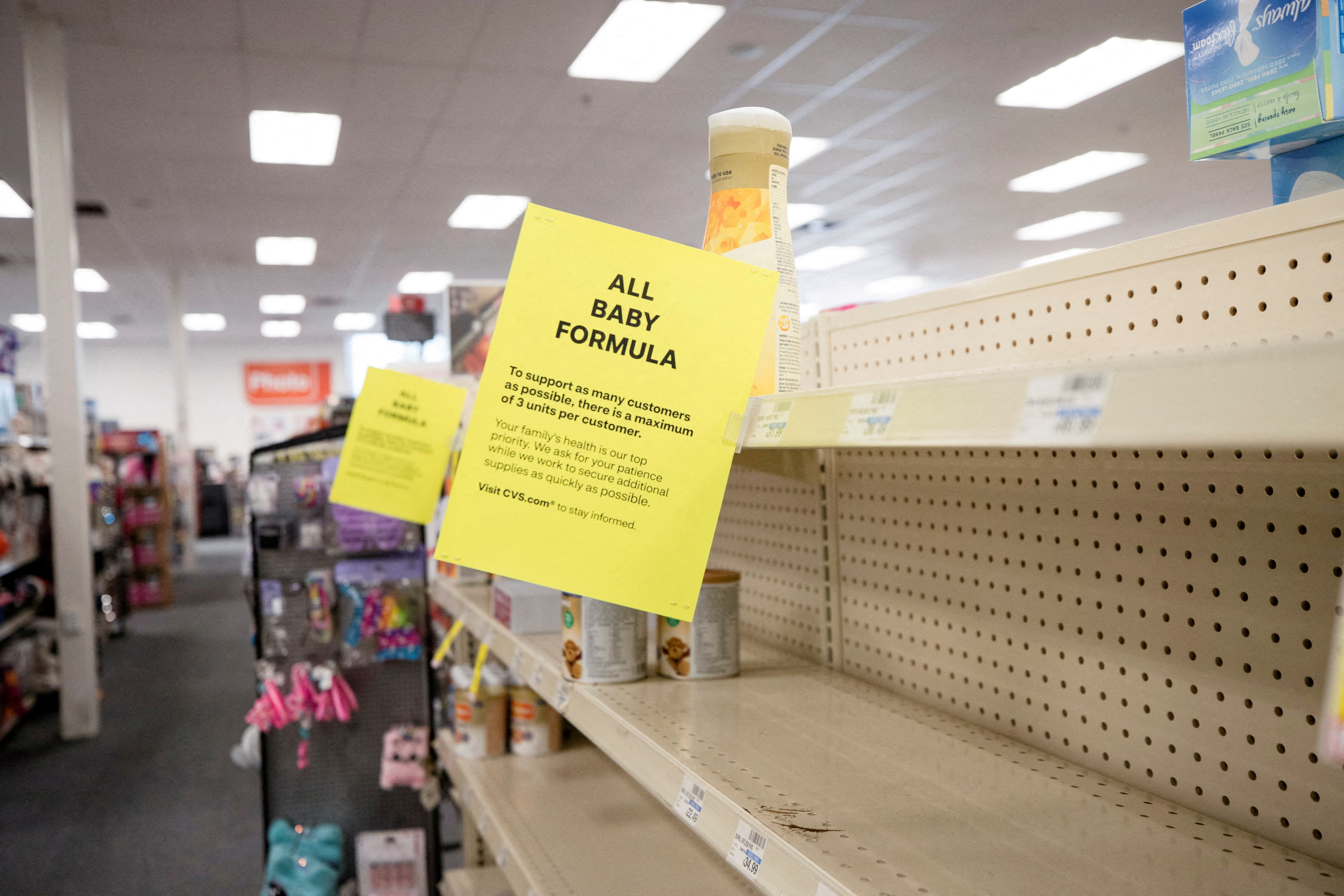 At a grocery store in Medford Massachusetts on May 17, 2022, shelves for baby and toddler formula are partially empty as the quantity a shopper can buy is limited amid continuing U.S. shortages.