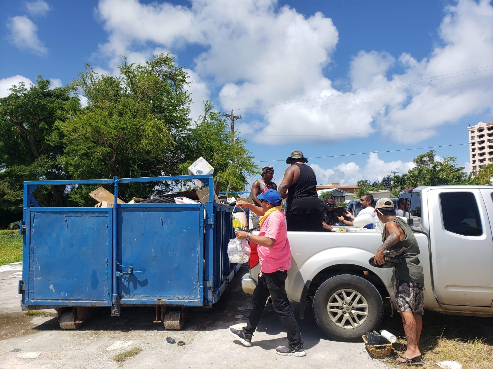 Residents off-load  their trash into the bins provided by the offices of Reps. Tina Sablan and John Paul Sablan during the Precinct 2 Spring Cleanup in Chalan Kanoa Saturday, May 21, 2022.
