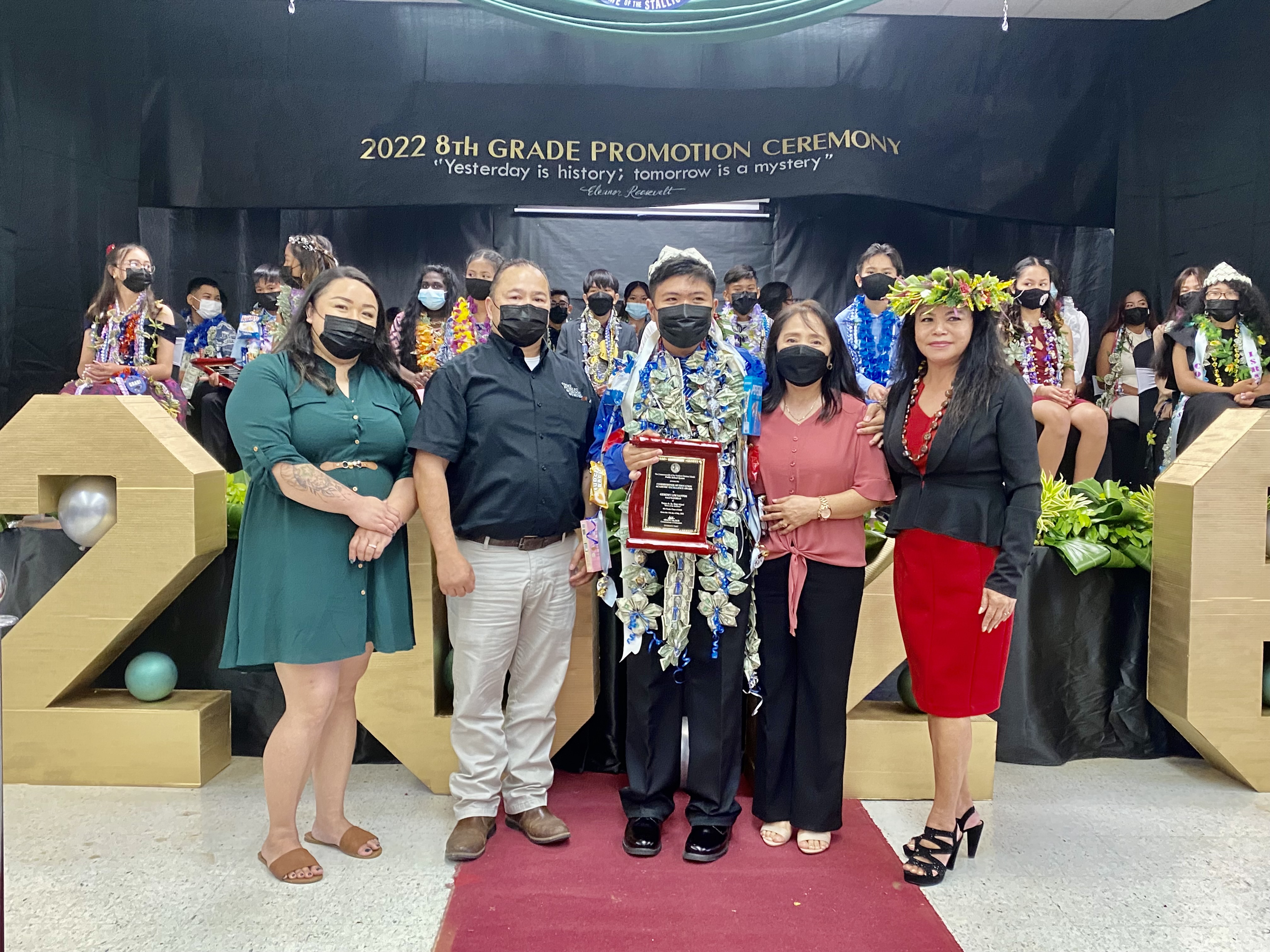 The Commissioner of Education Award went to class salutatorian Geremy Lim Santos. With the newly promoted eighth grader are his mother, Commissioner of Education Dr. Alfred B. Ada, Principal Lizabeth Hofschneider and Vice Principal Nikita Mendiola.